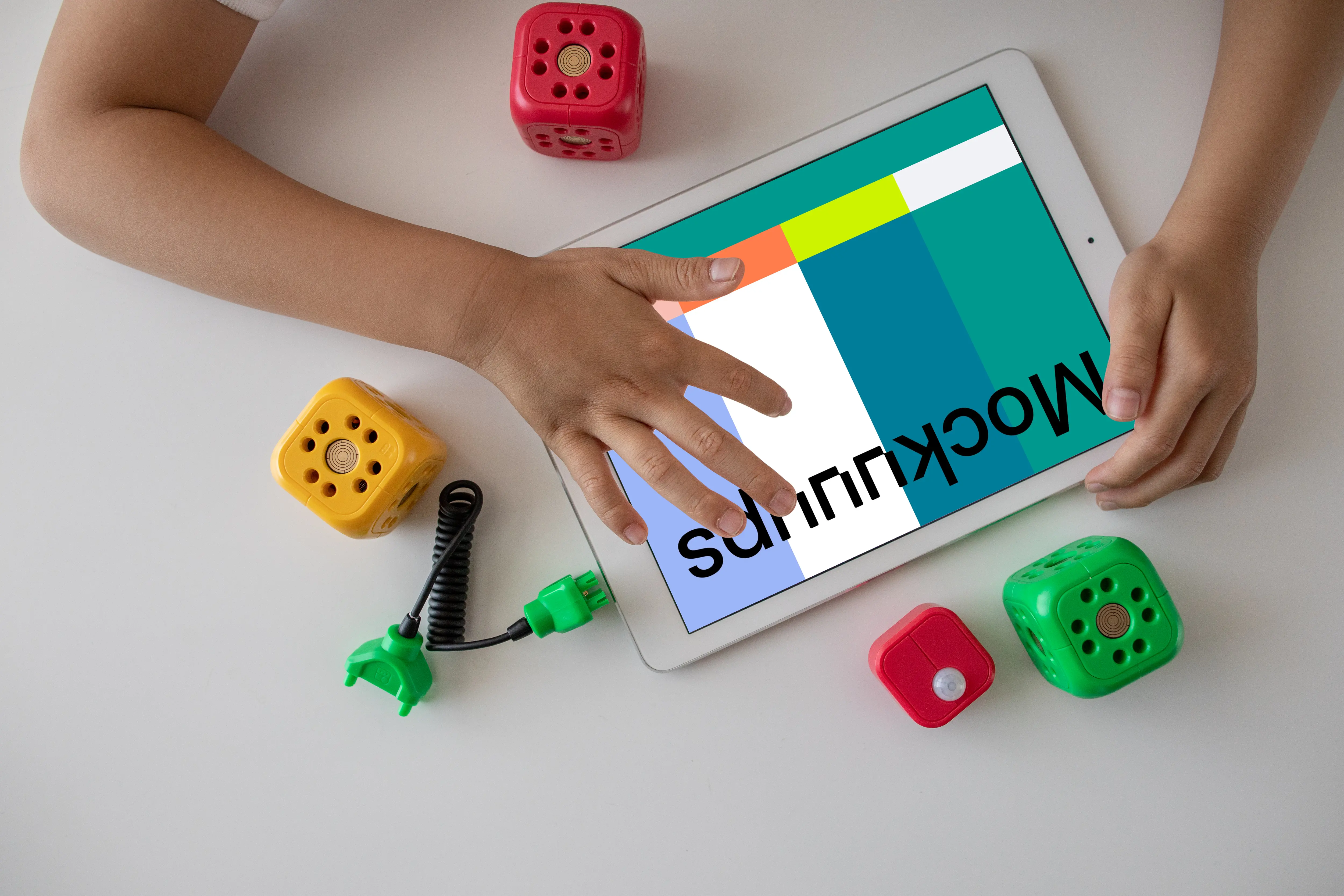 Child playing a game on an iPad mockup