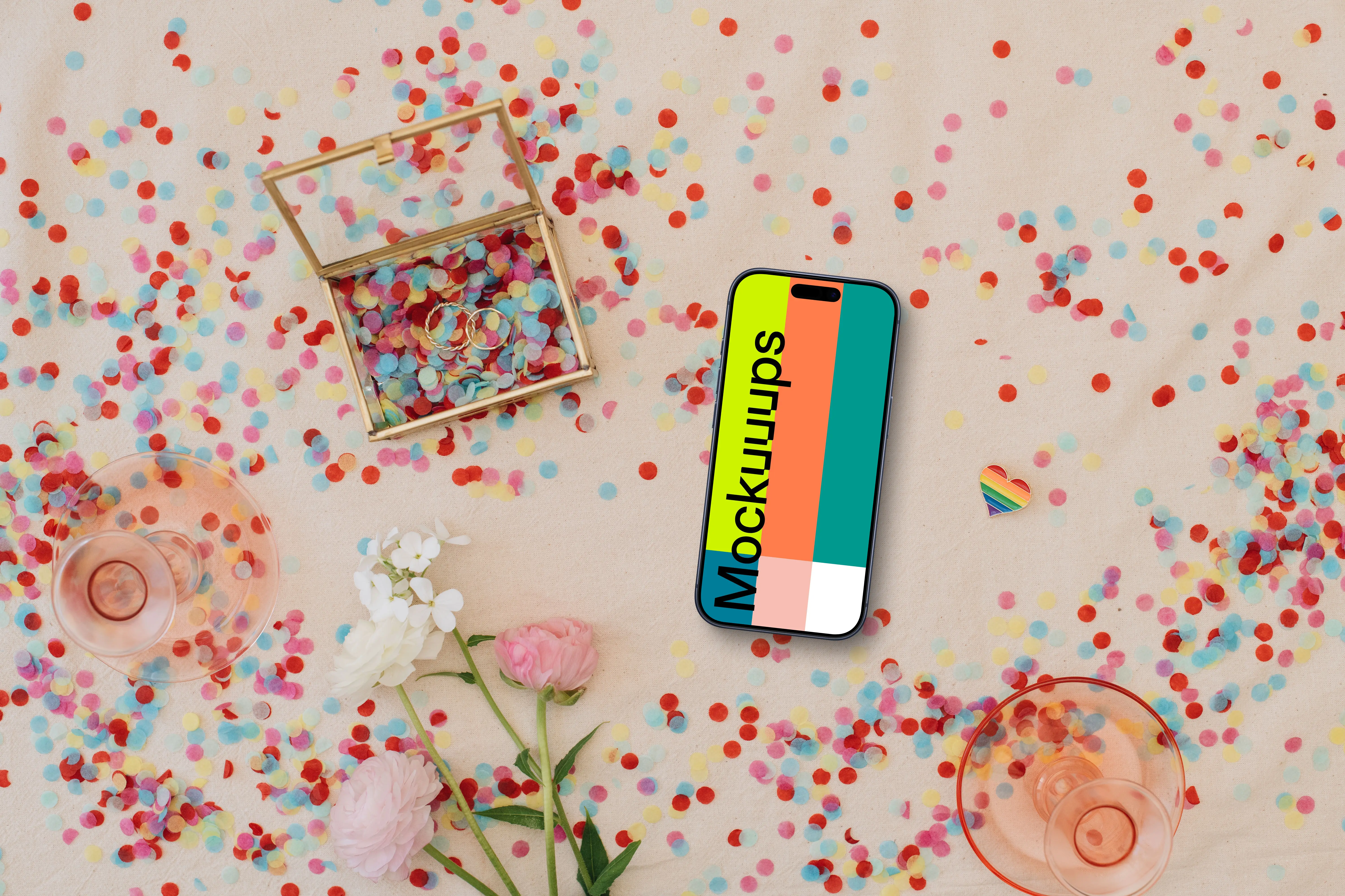 Confetti and wedding rings around iPhone mockup