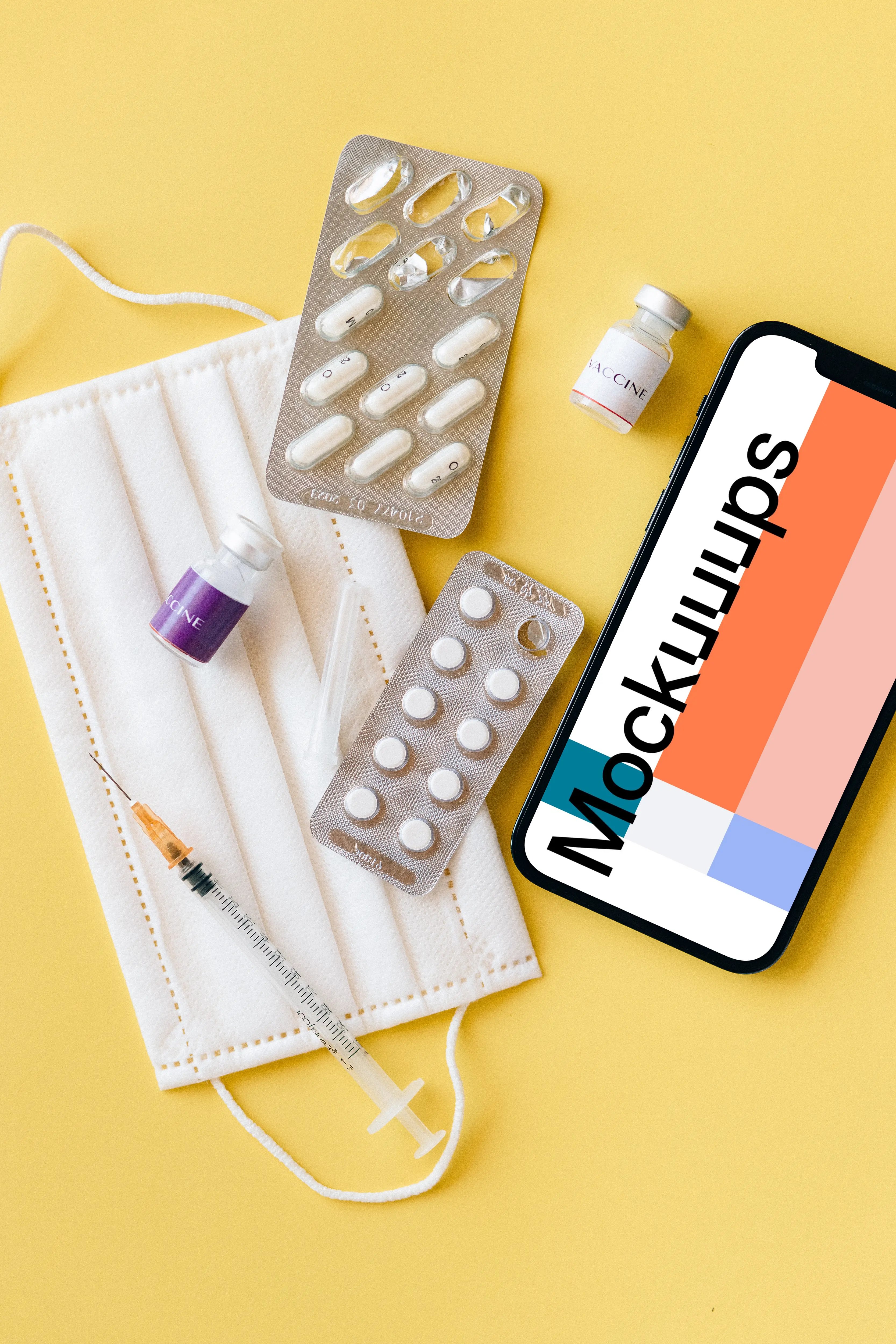 iPhone 12 Pro mockup on a table beside some medicines