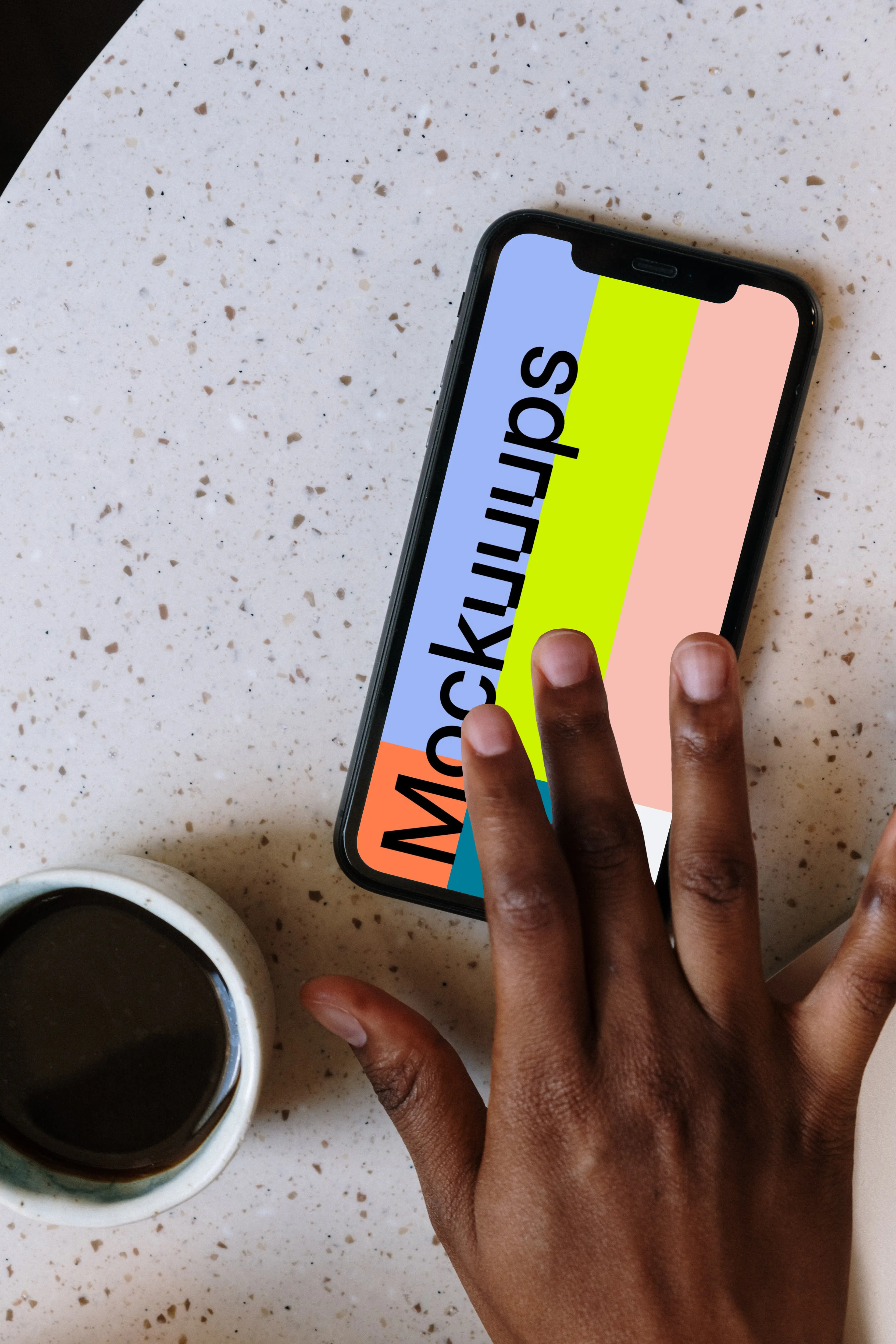 iPhone mockup beside a small cup of coffee