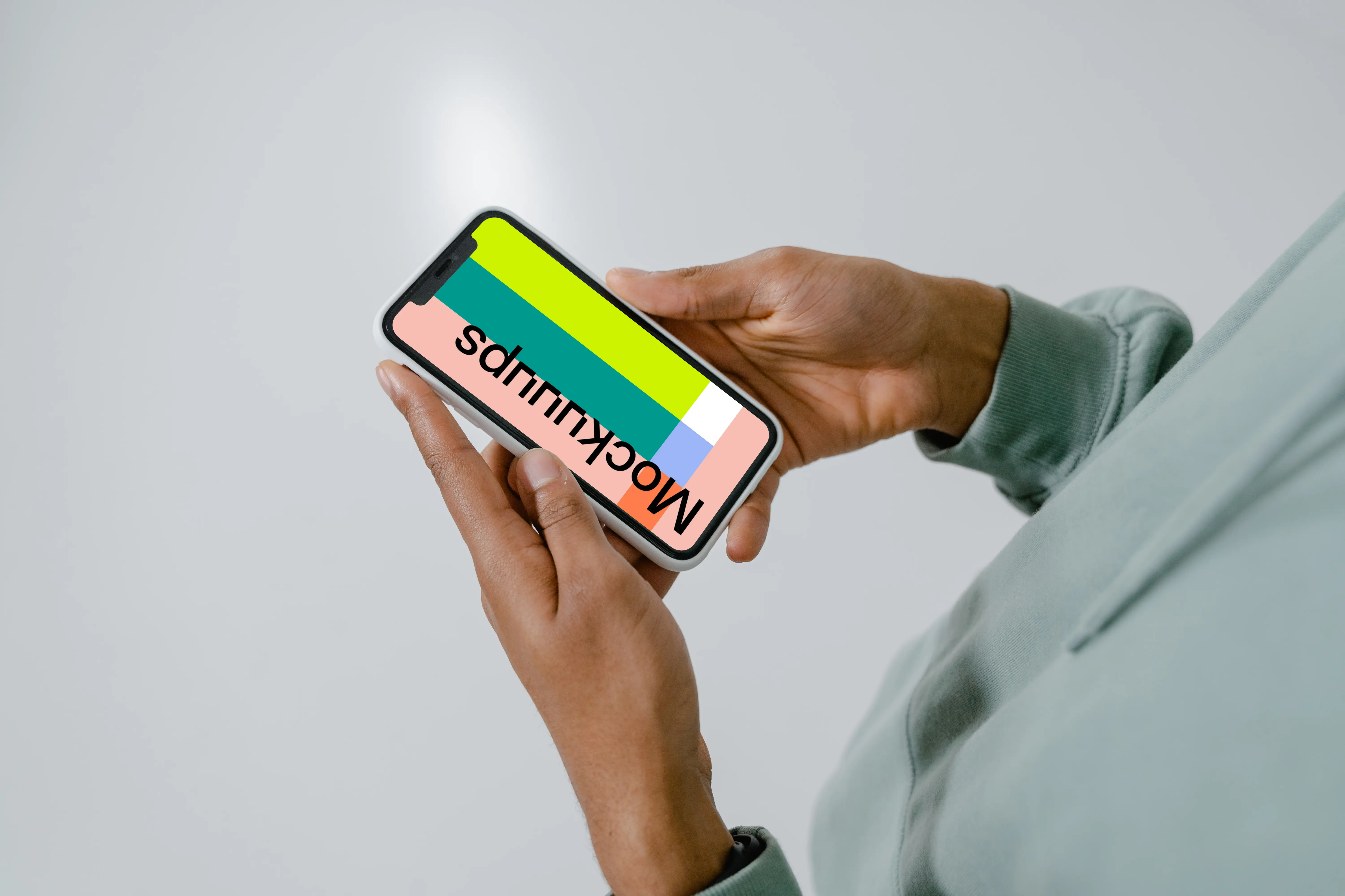 iPhone mockup in user’s hand