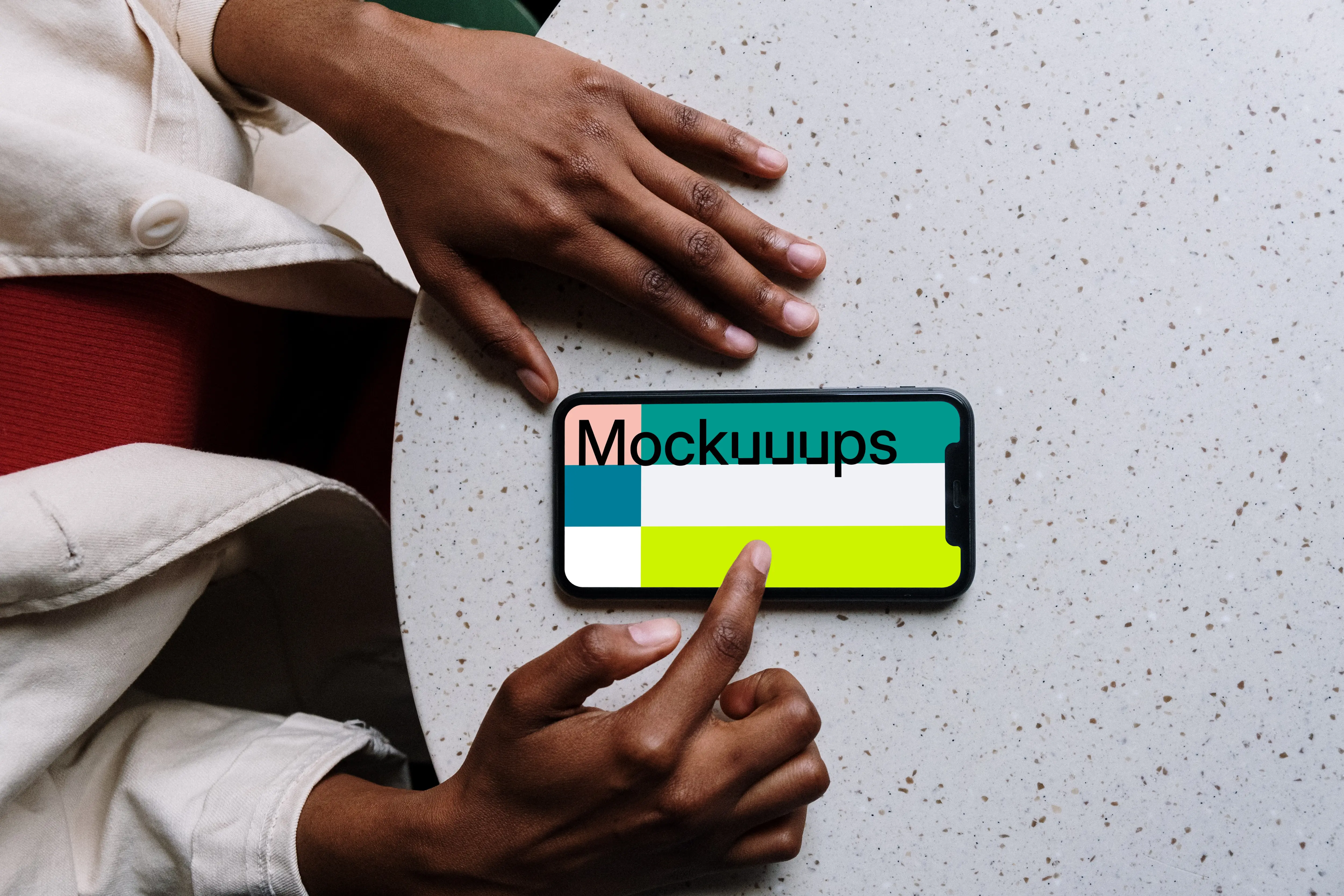 iPhone mockup on white table