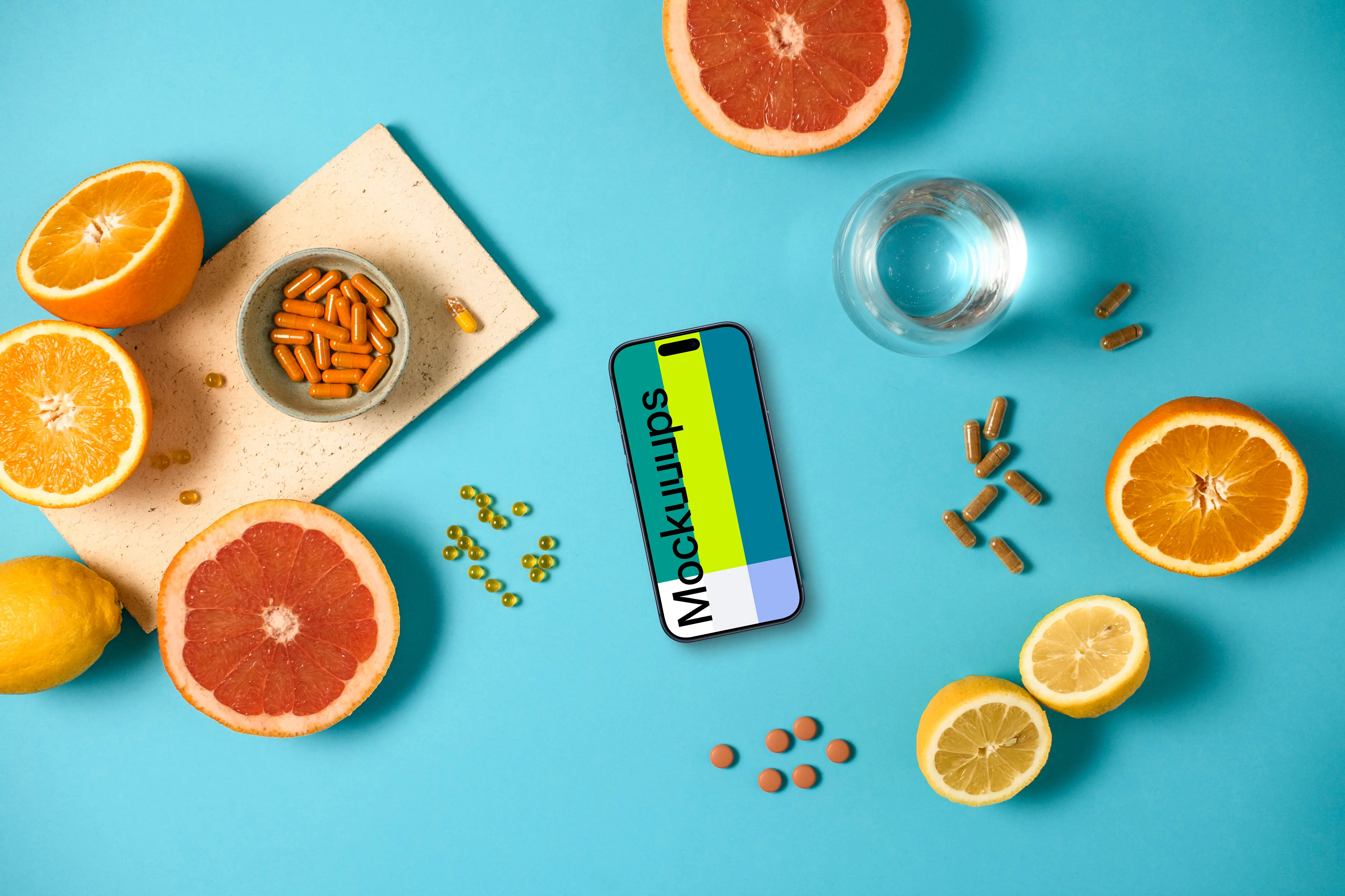 iPhone mockup with oranges and pills