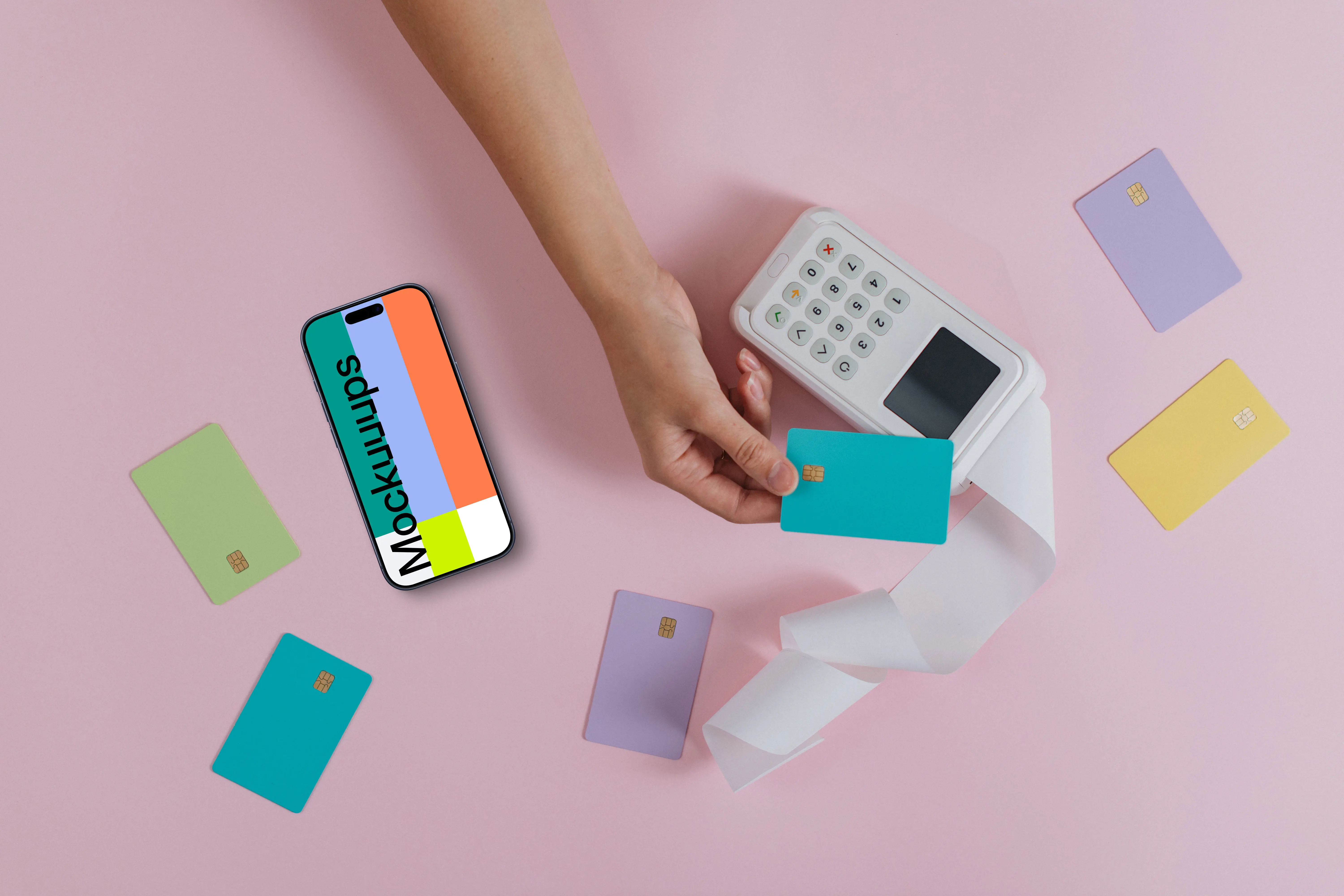 iPhone surrounded by credit card on pink background