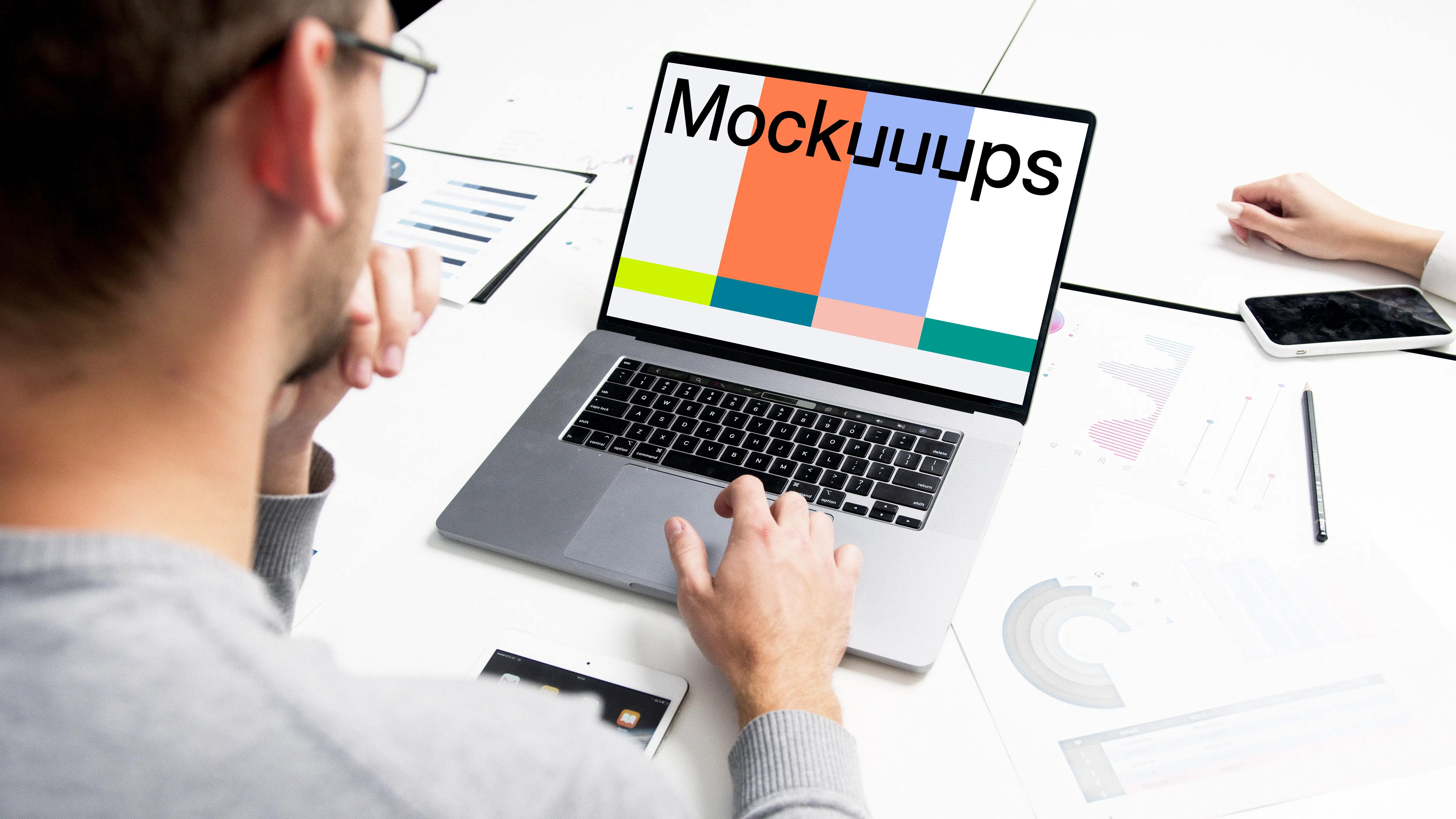 MacBook Pro mockup in a meeting