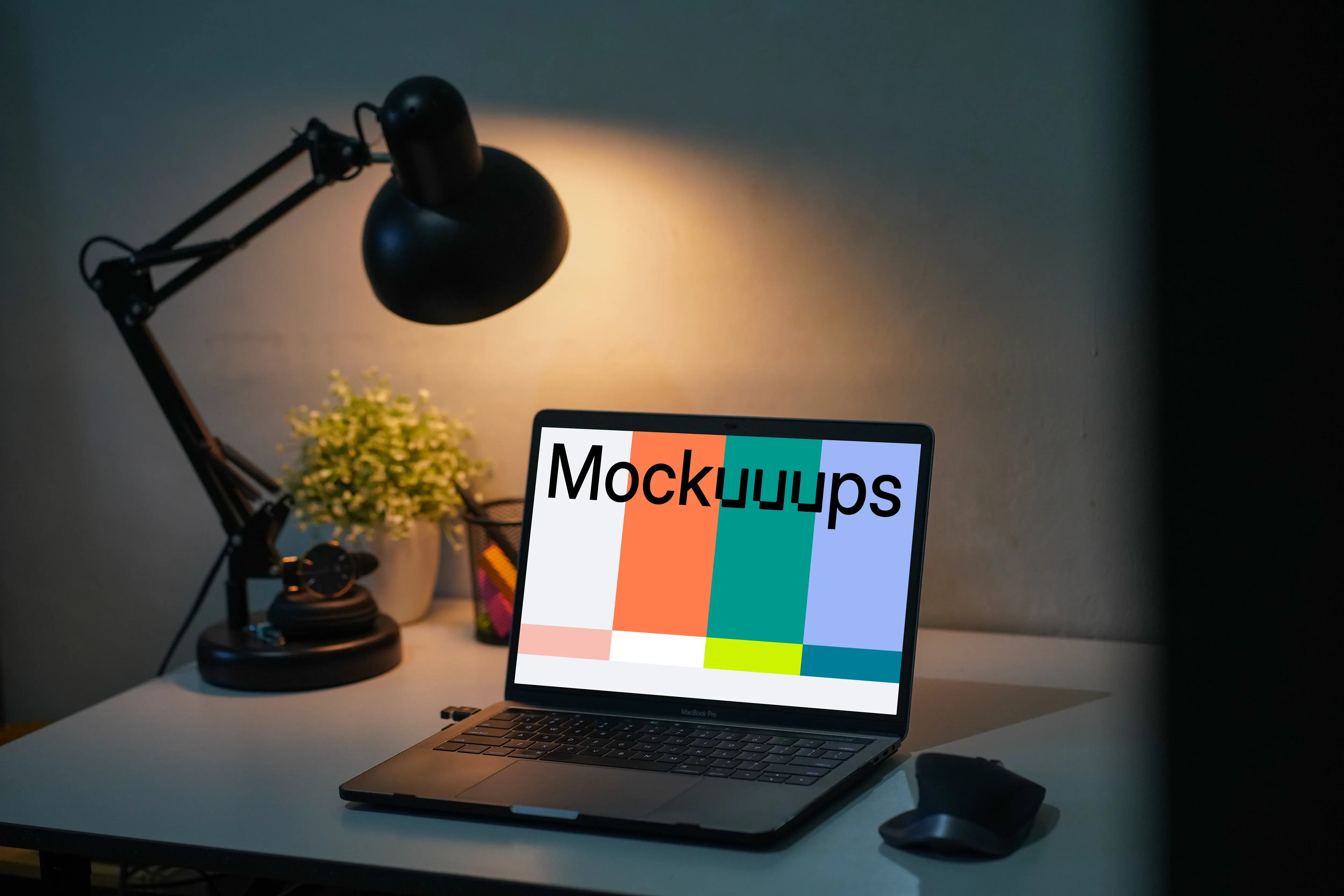 MacBook Pro mockup on a table with reading light