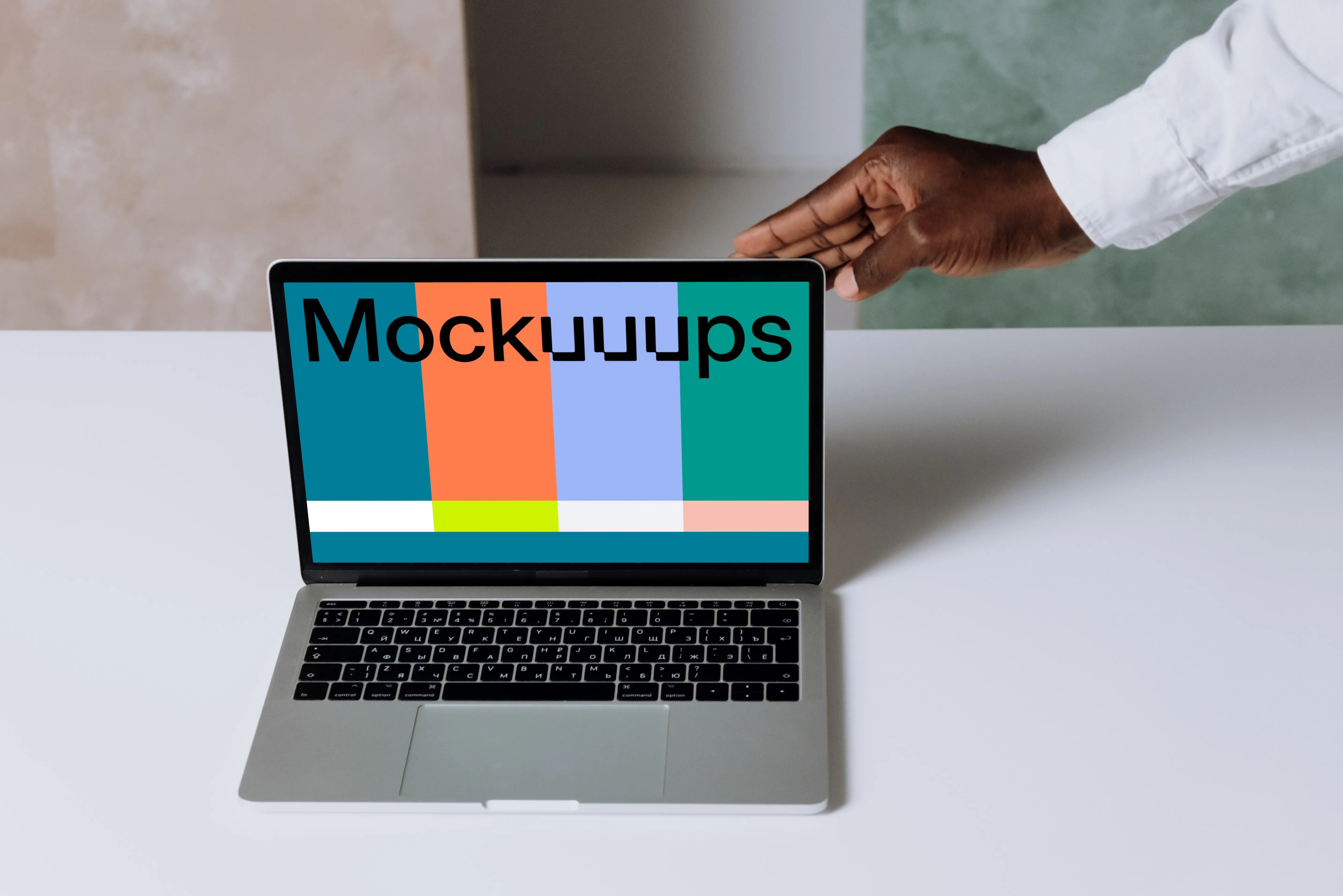 MacBook Pro mockup on a white table in presentation view