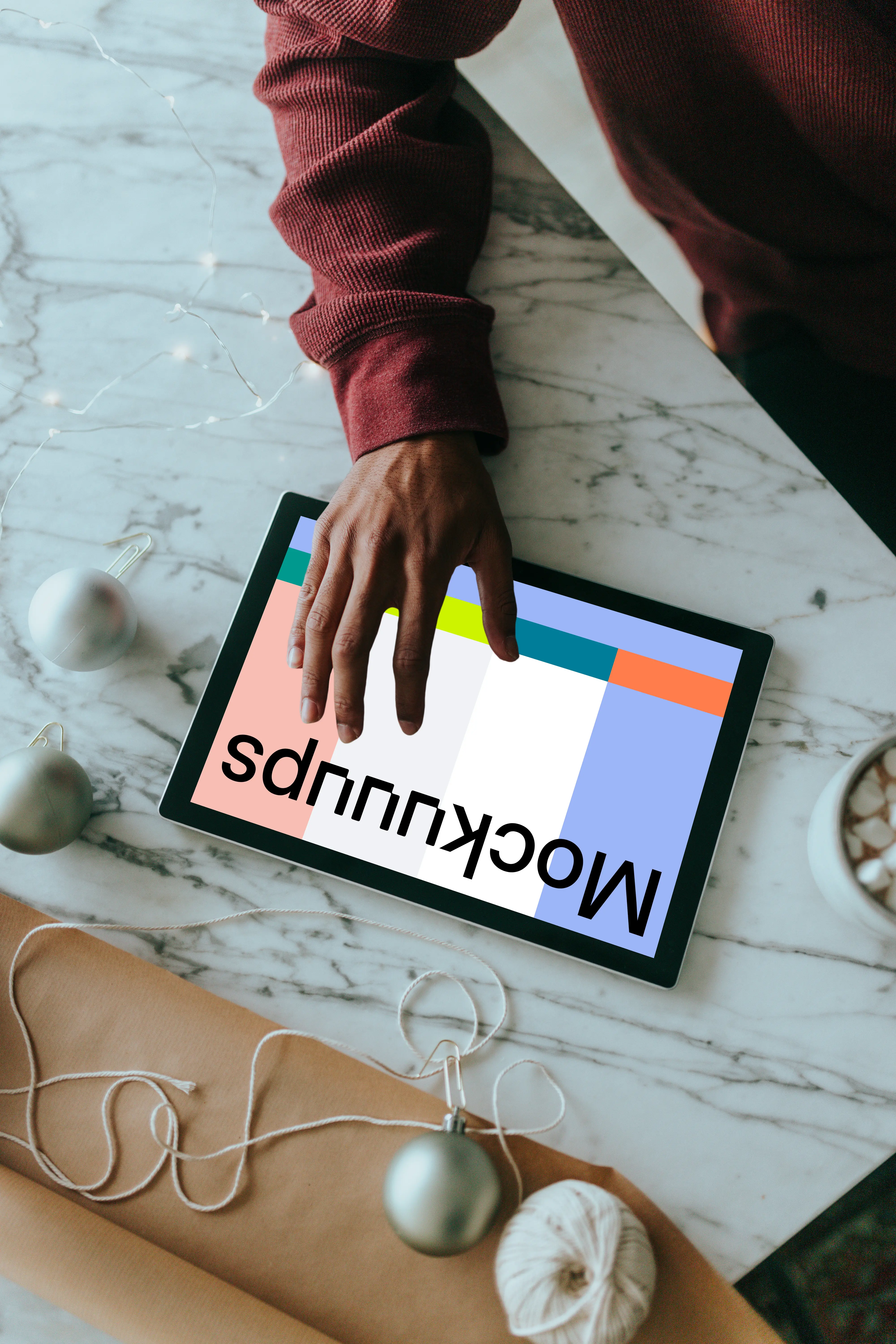 Microsoft Surface mockup held by a user on a marble table