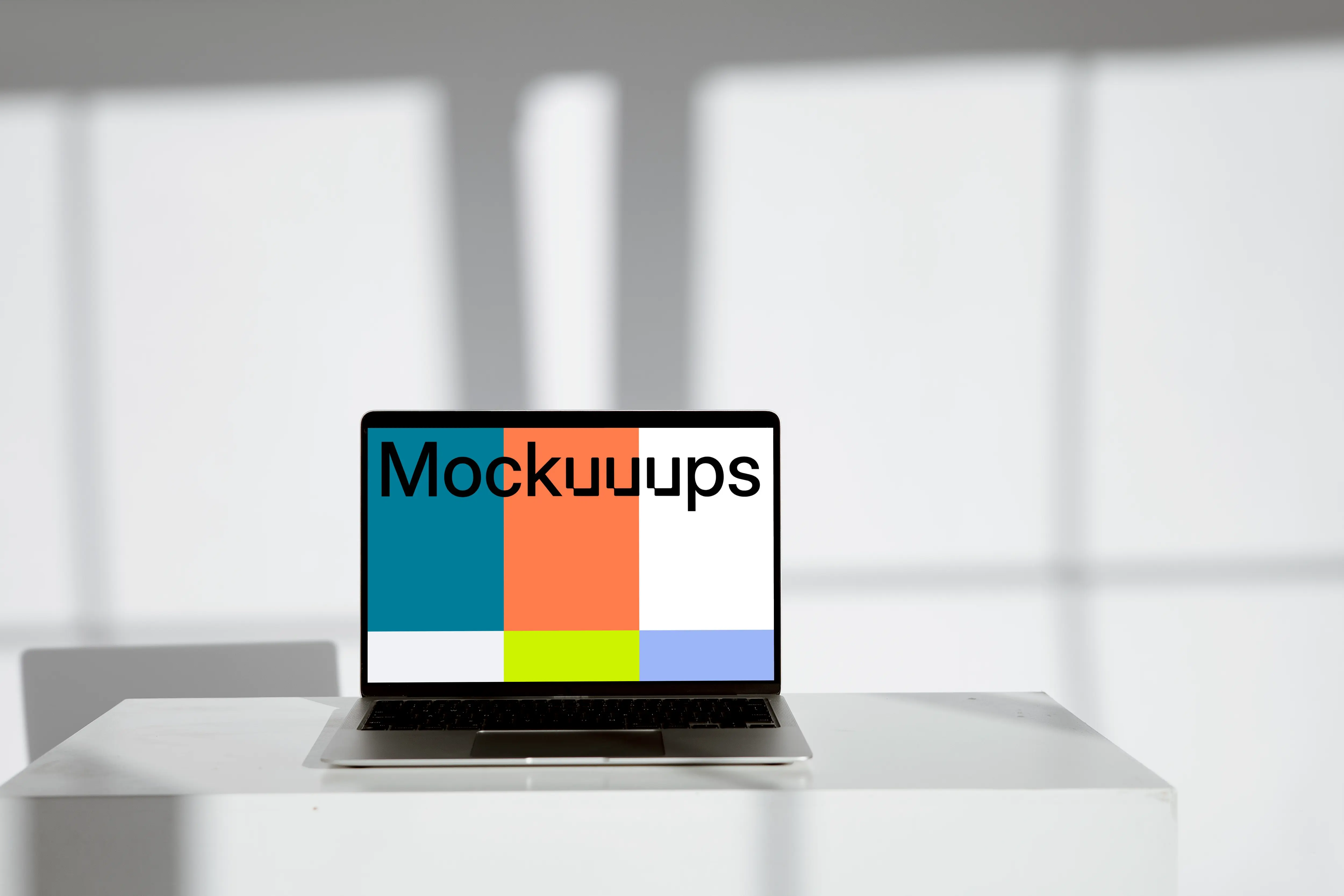 Minimal MacBook mockup on a white table