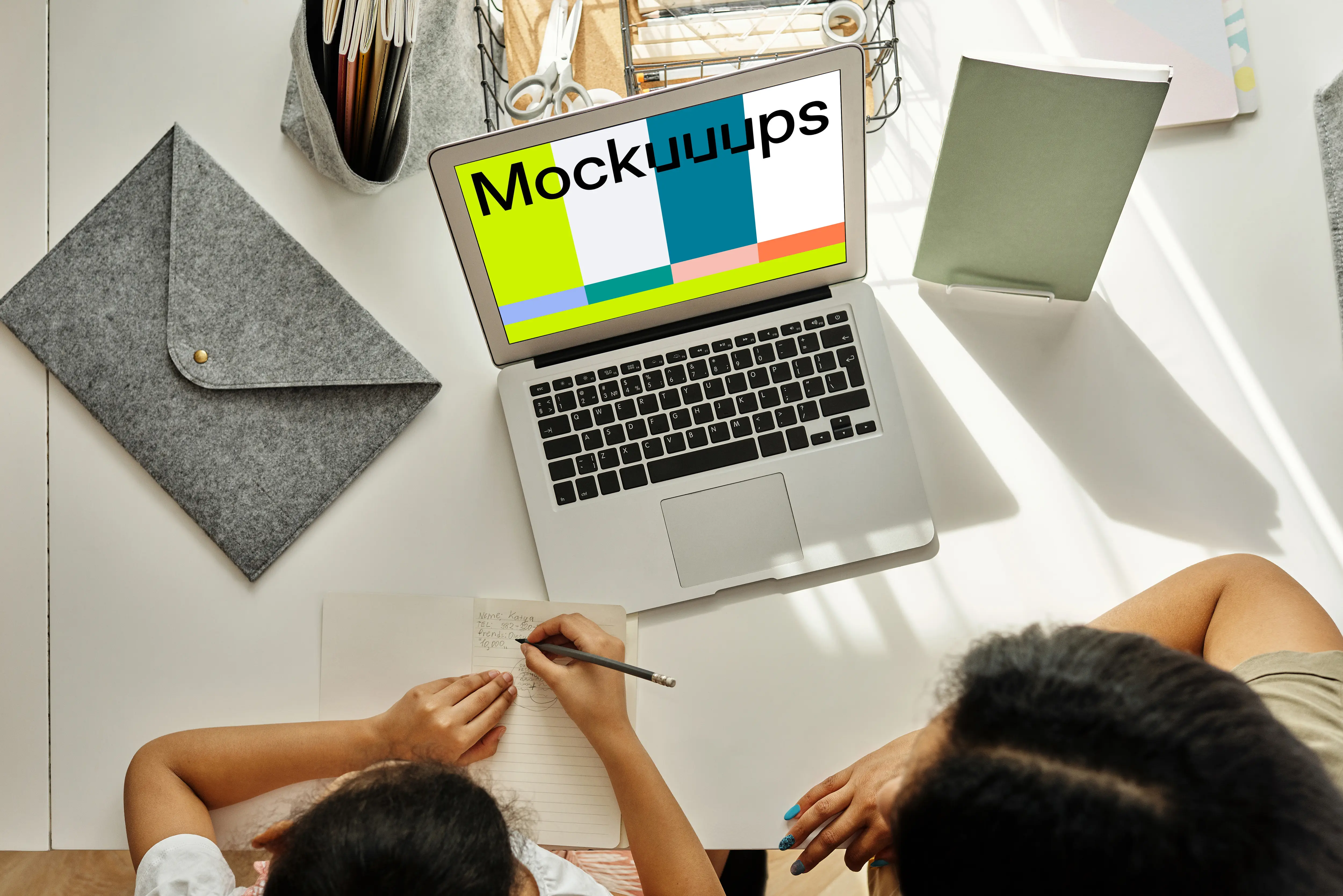 Mockup of adult teaching a kid using a MacBook Air