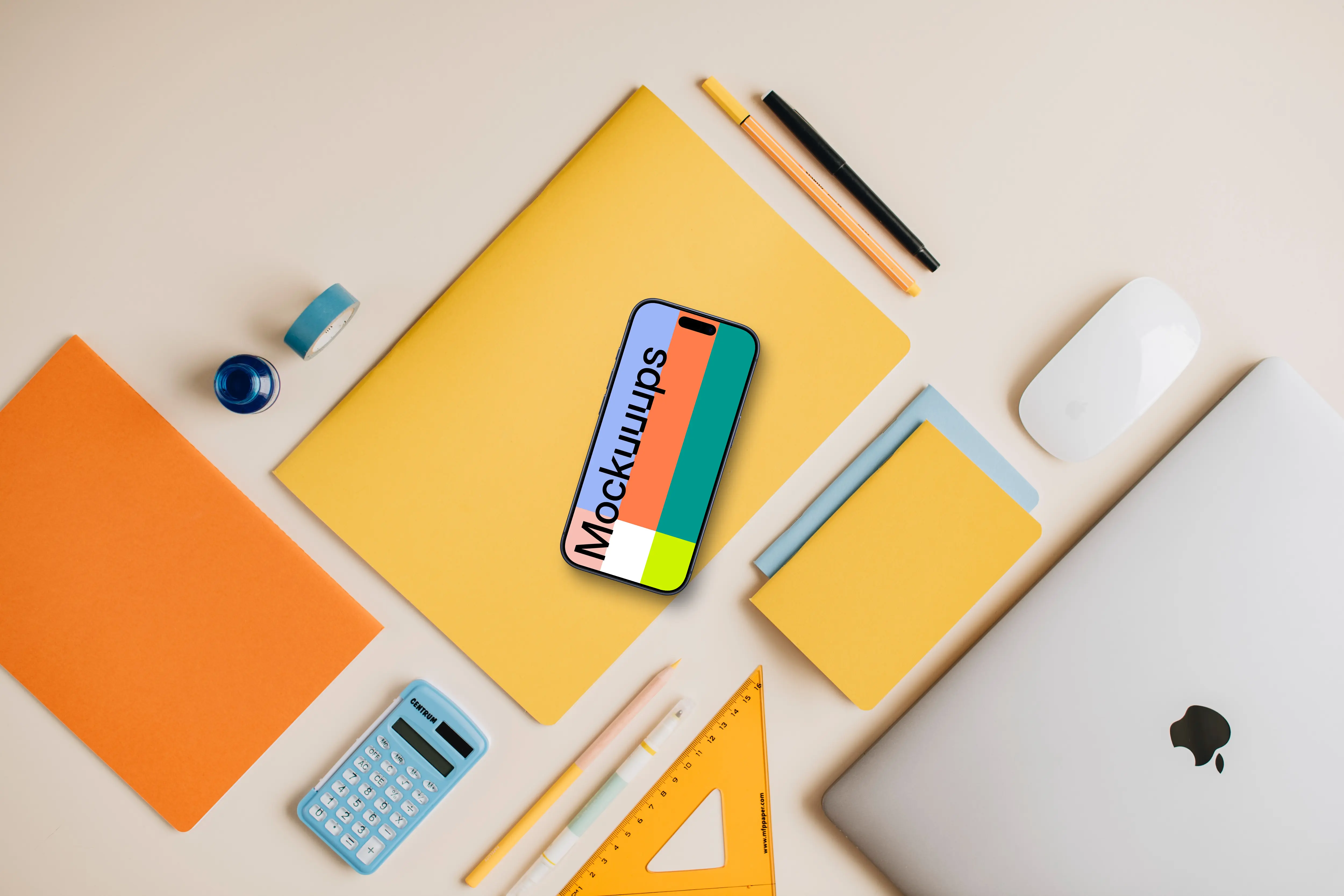 Mockup of smartphone placed on the yellow notebook