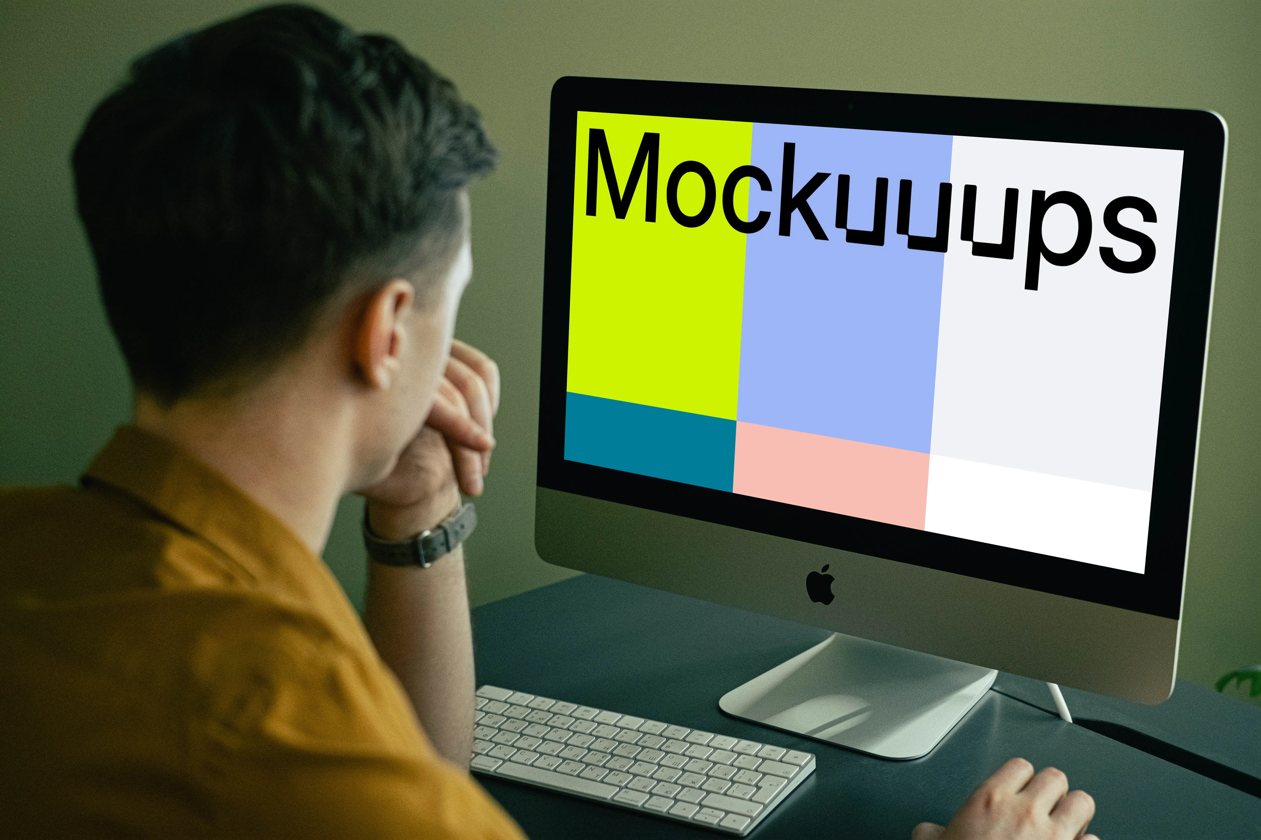 Mockup of user staring at his iMac when working