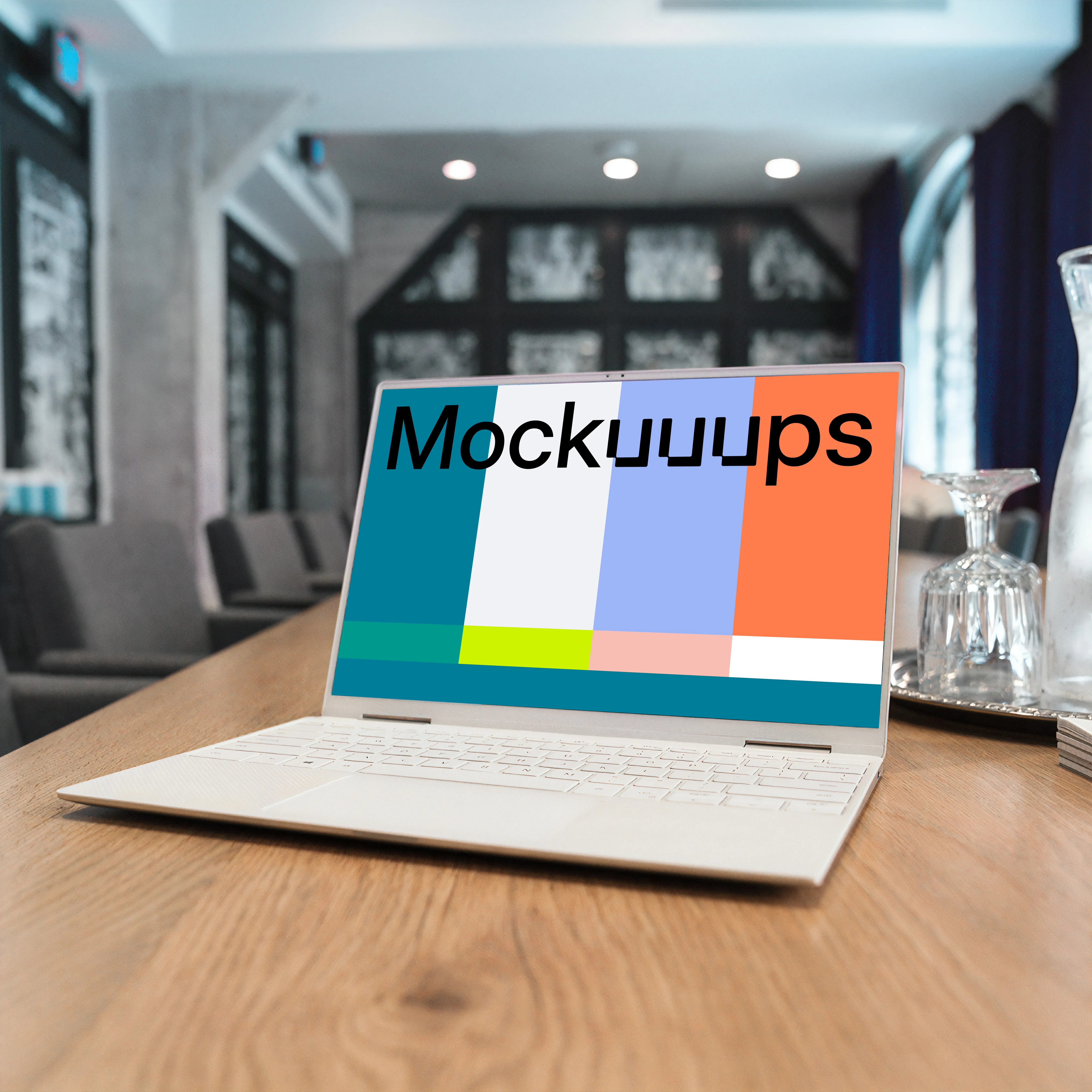 White Dell XPS Mockup on a table with wine glasses at the side