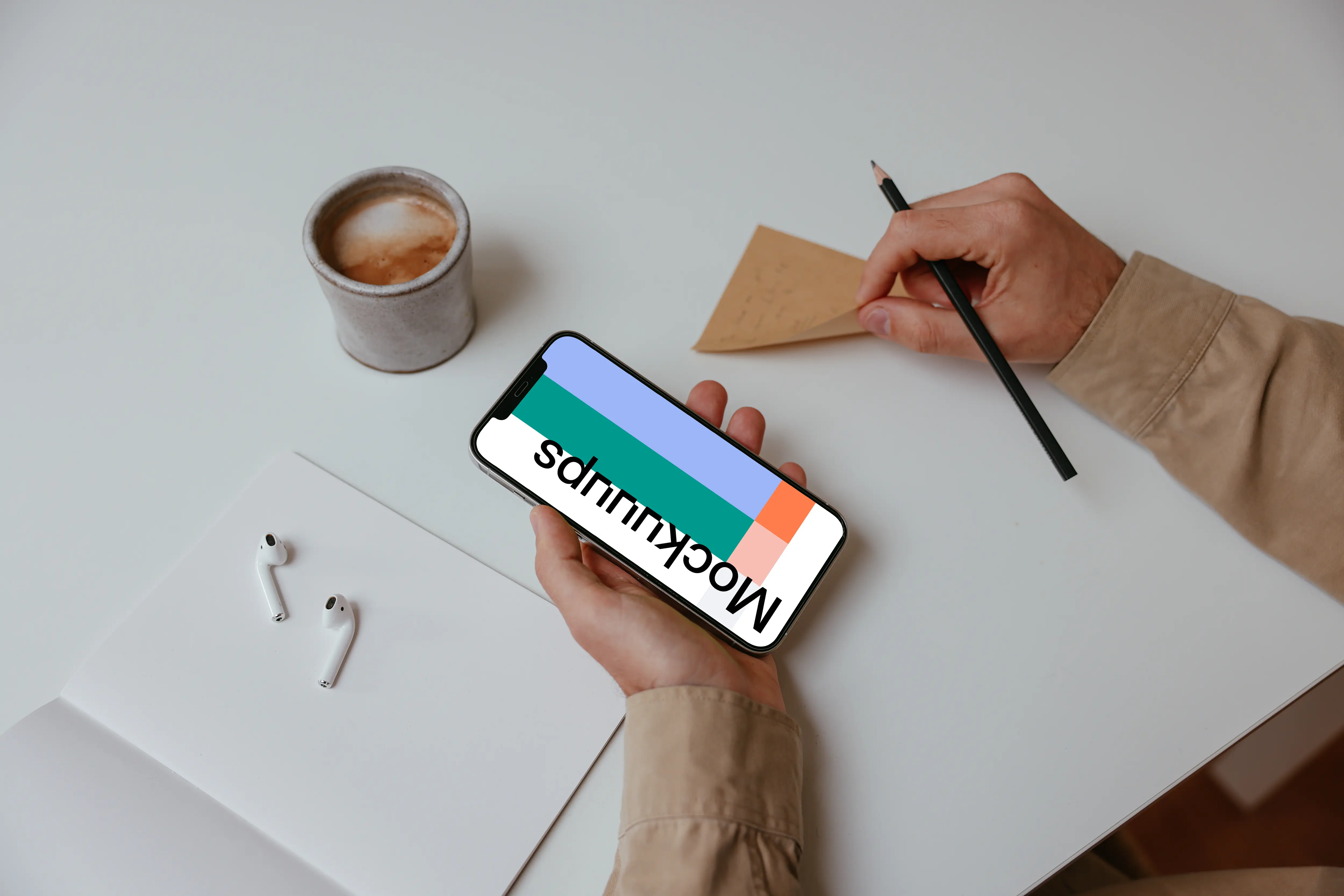 Person holding iPhone Mockup