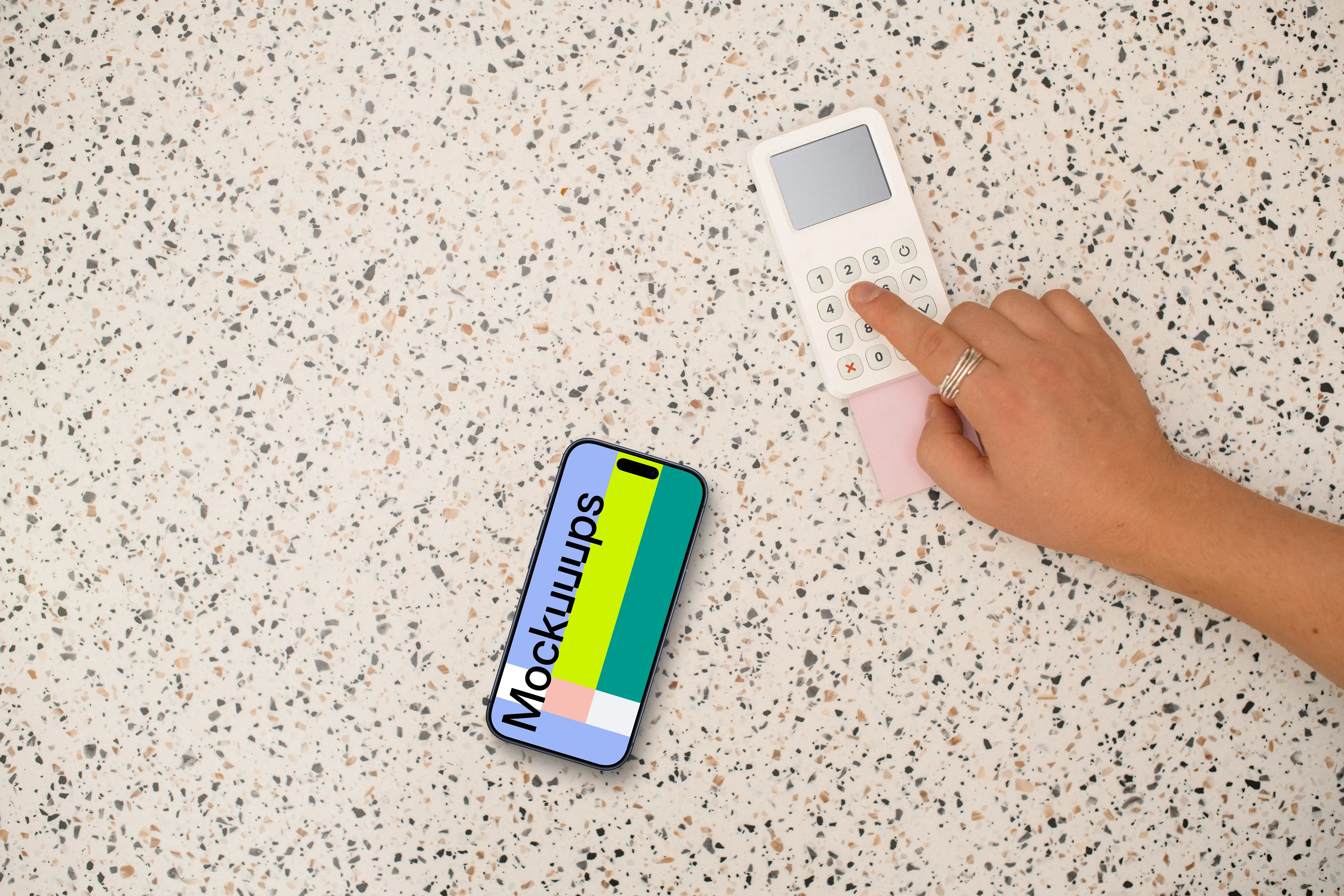 Person paying next to the iPhone mockup