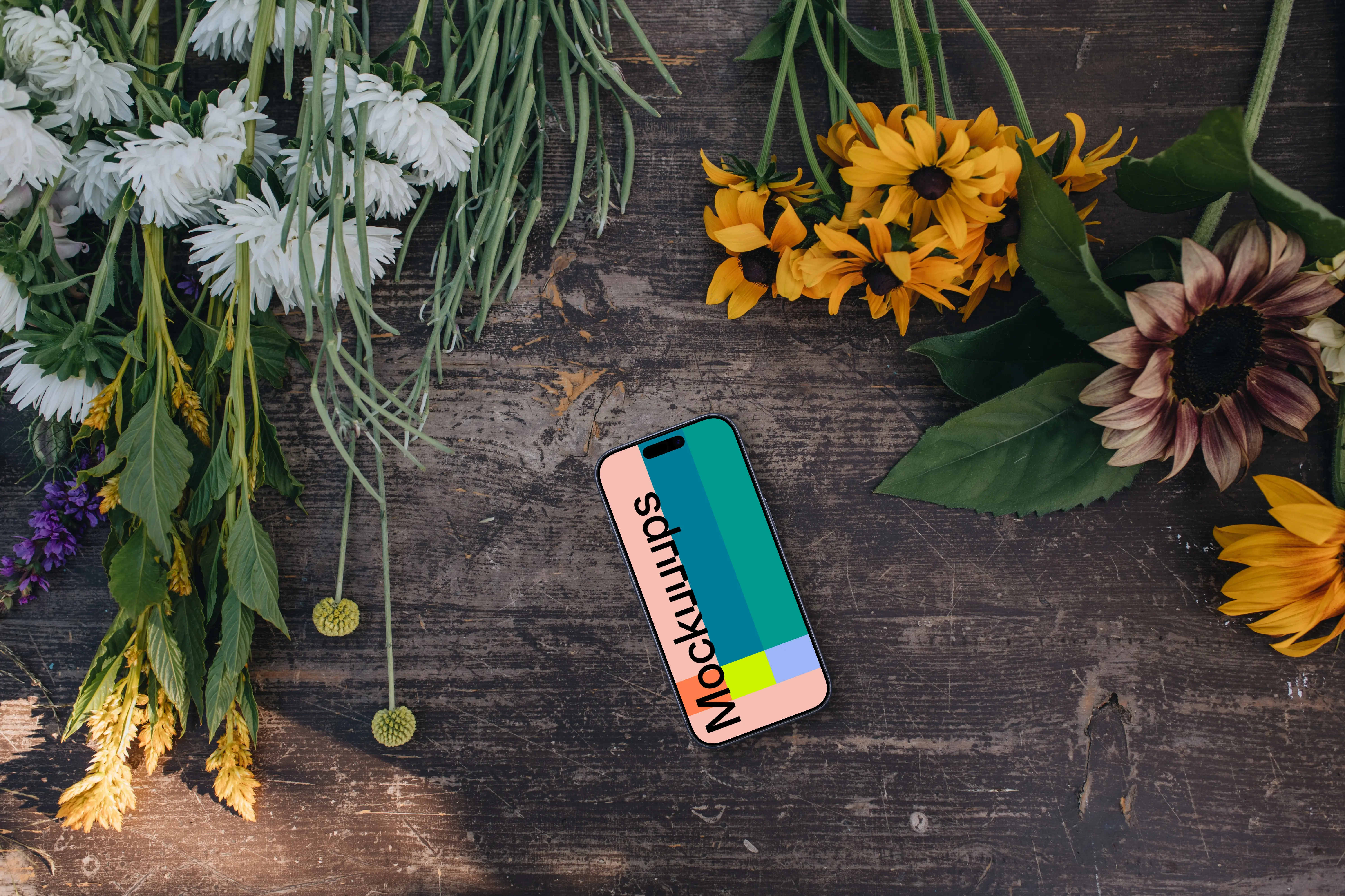 Phone mockup next to flowers