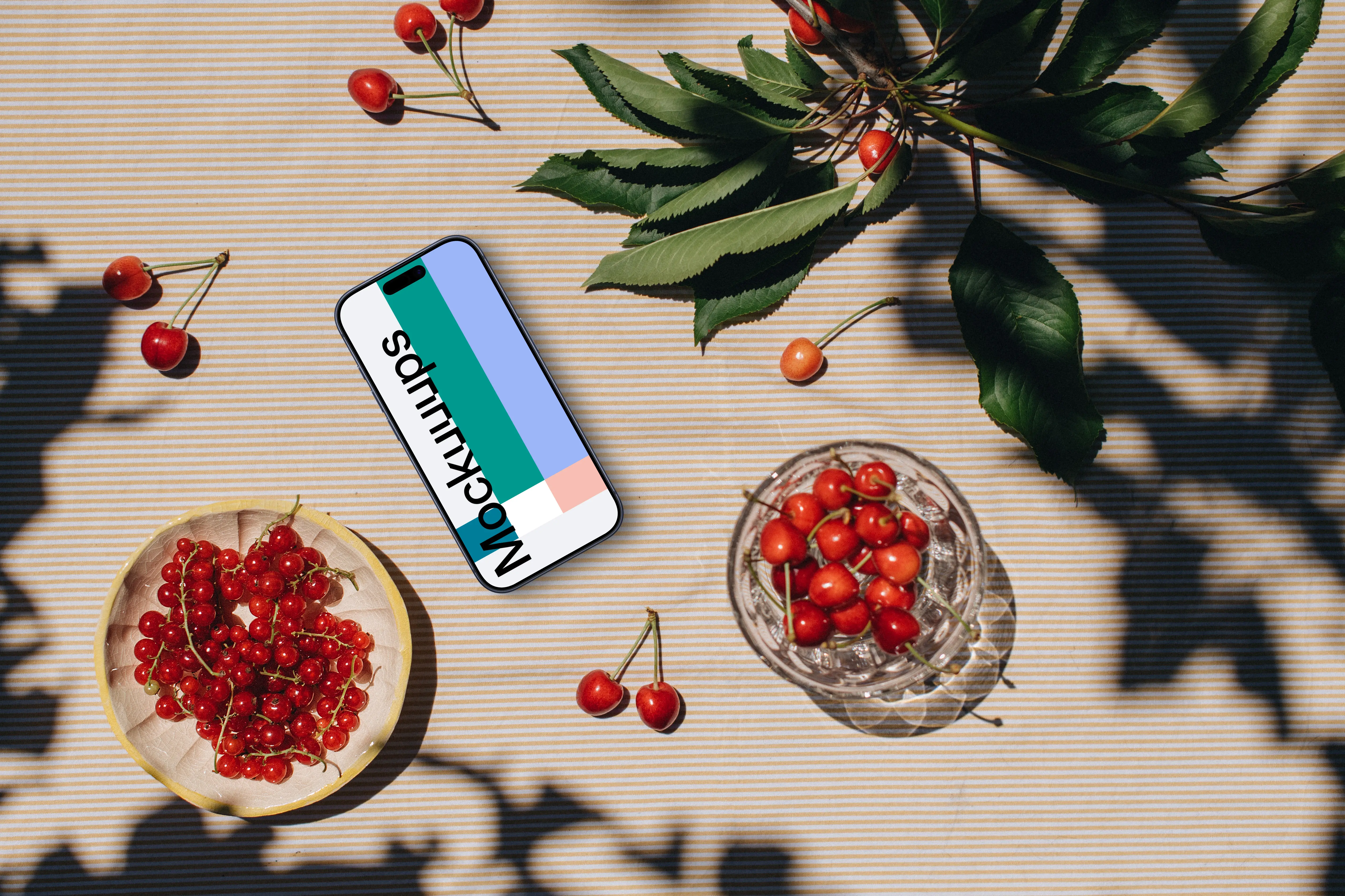 Phone mockup with a fresh fruit on the table
