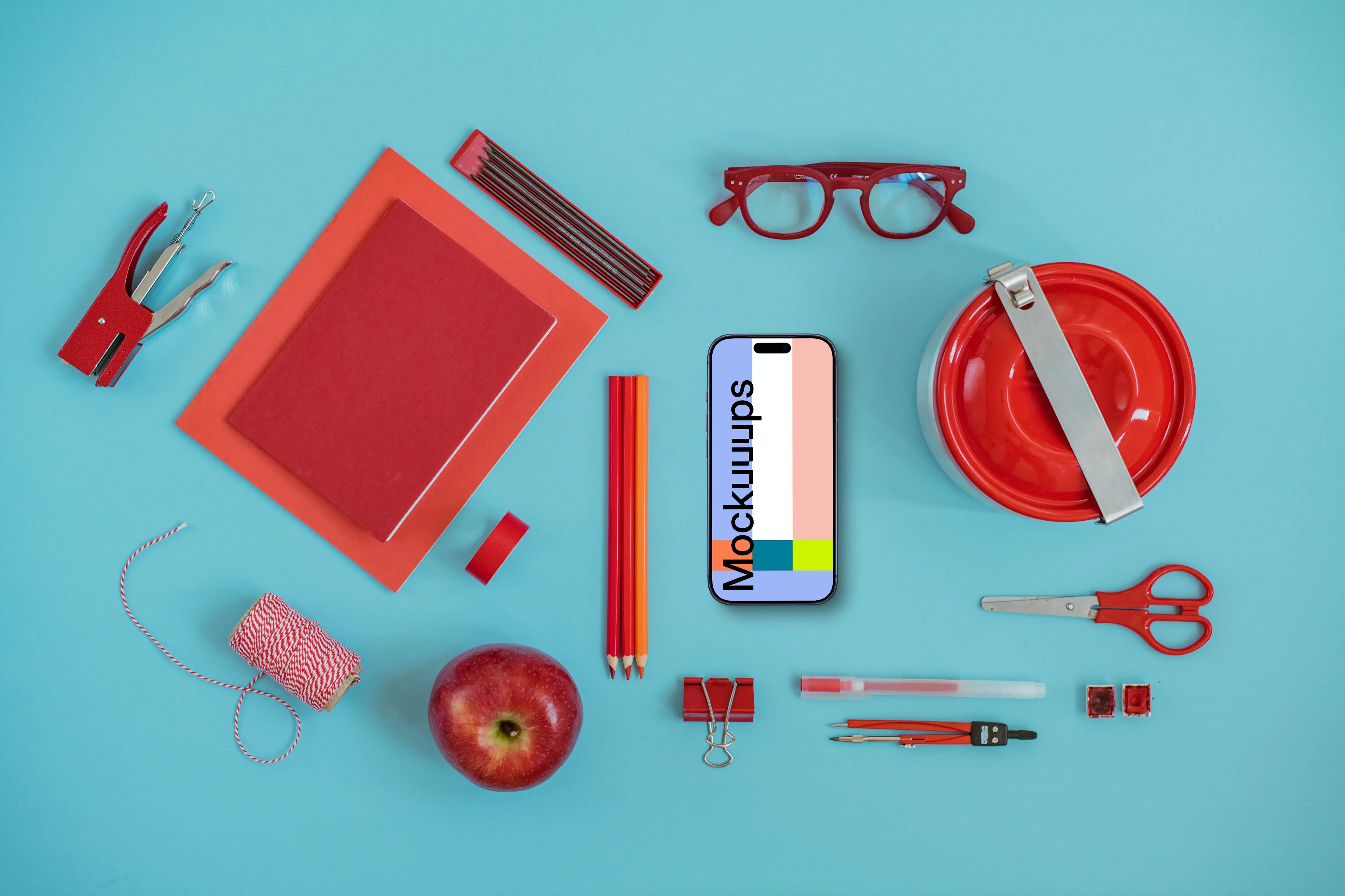 Phone mockup with a school equipment around