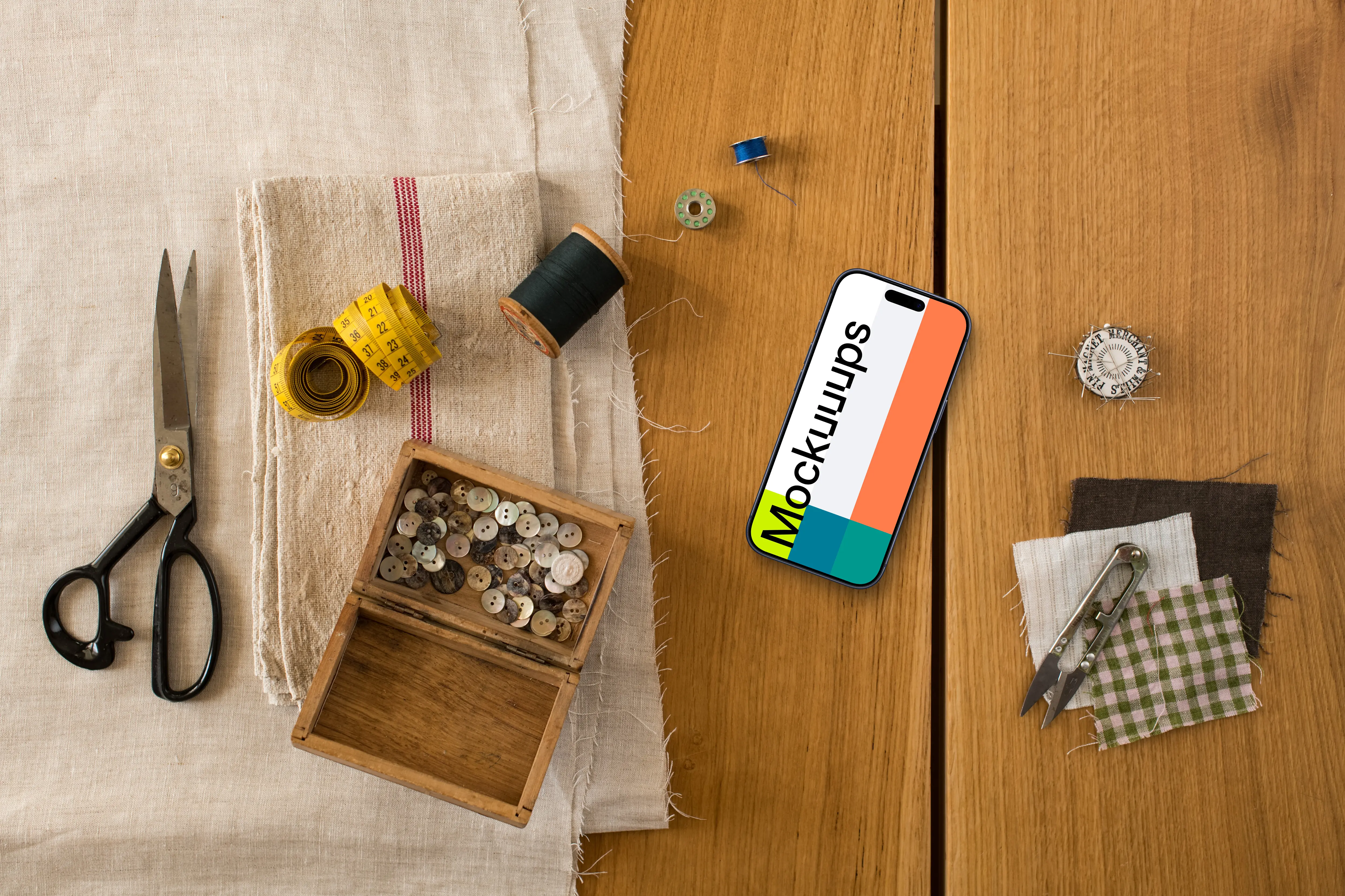 Smartphone mockup and natural fabrics on the wooden table