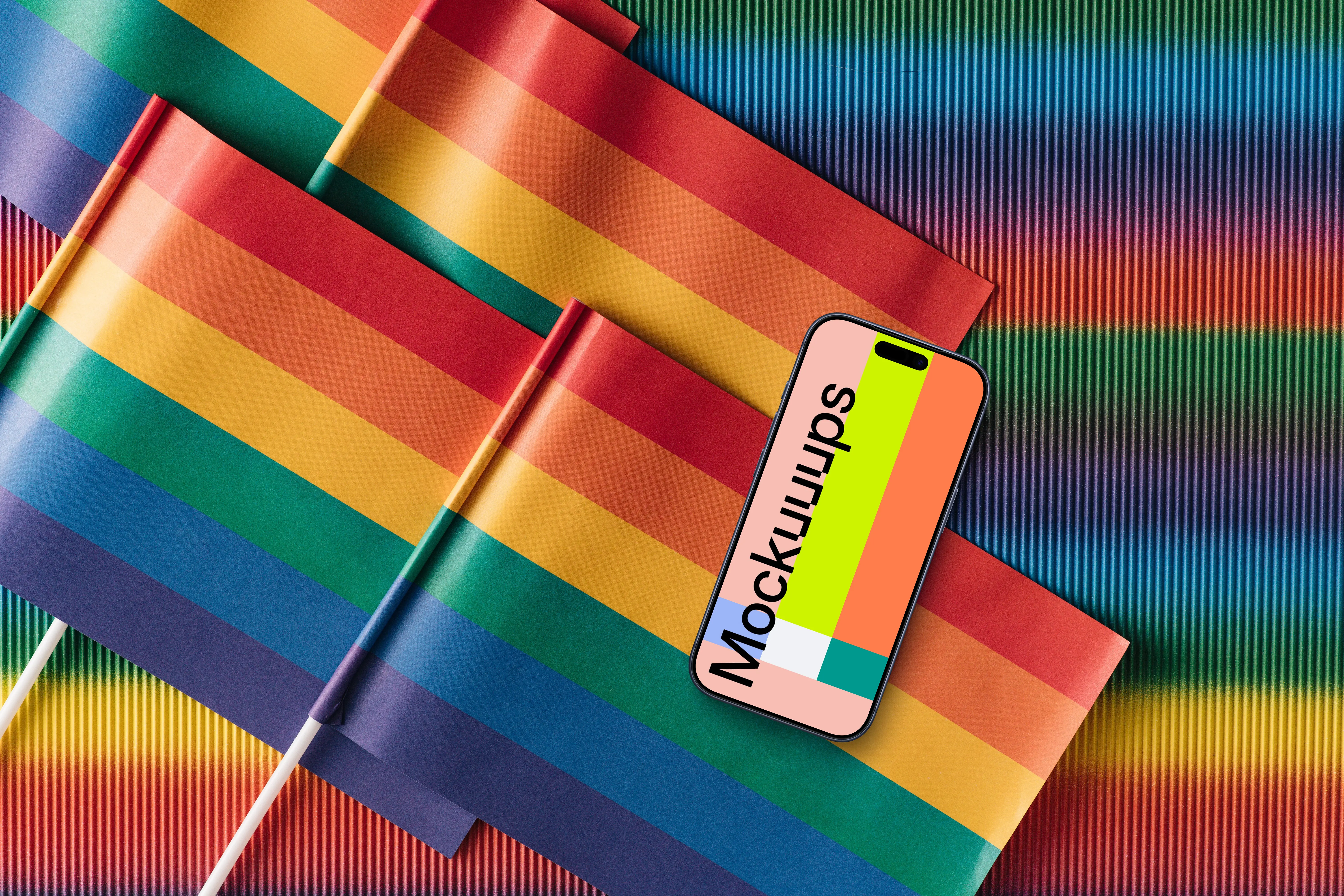 Smartphone mockup laying on pride flags