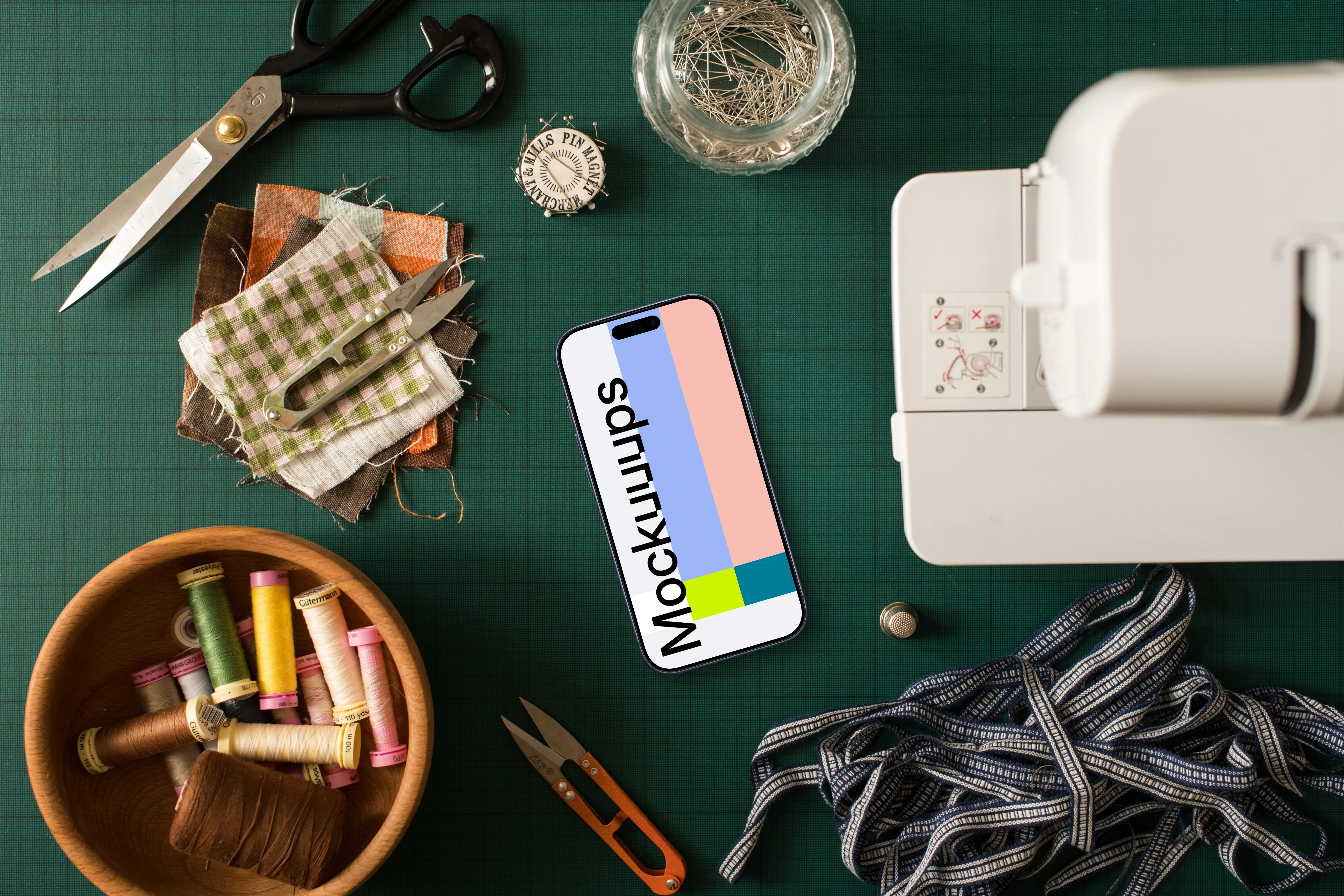 Smartphone mockup next to the sewing machine