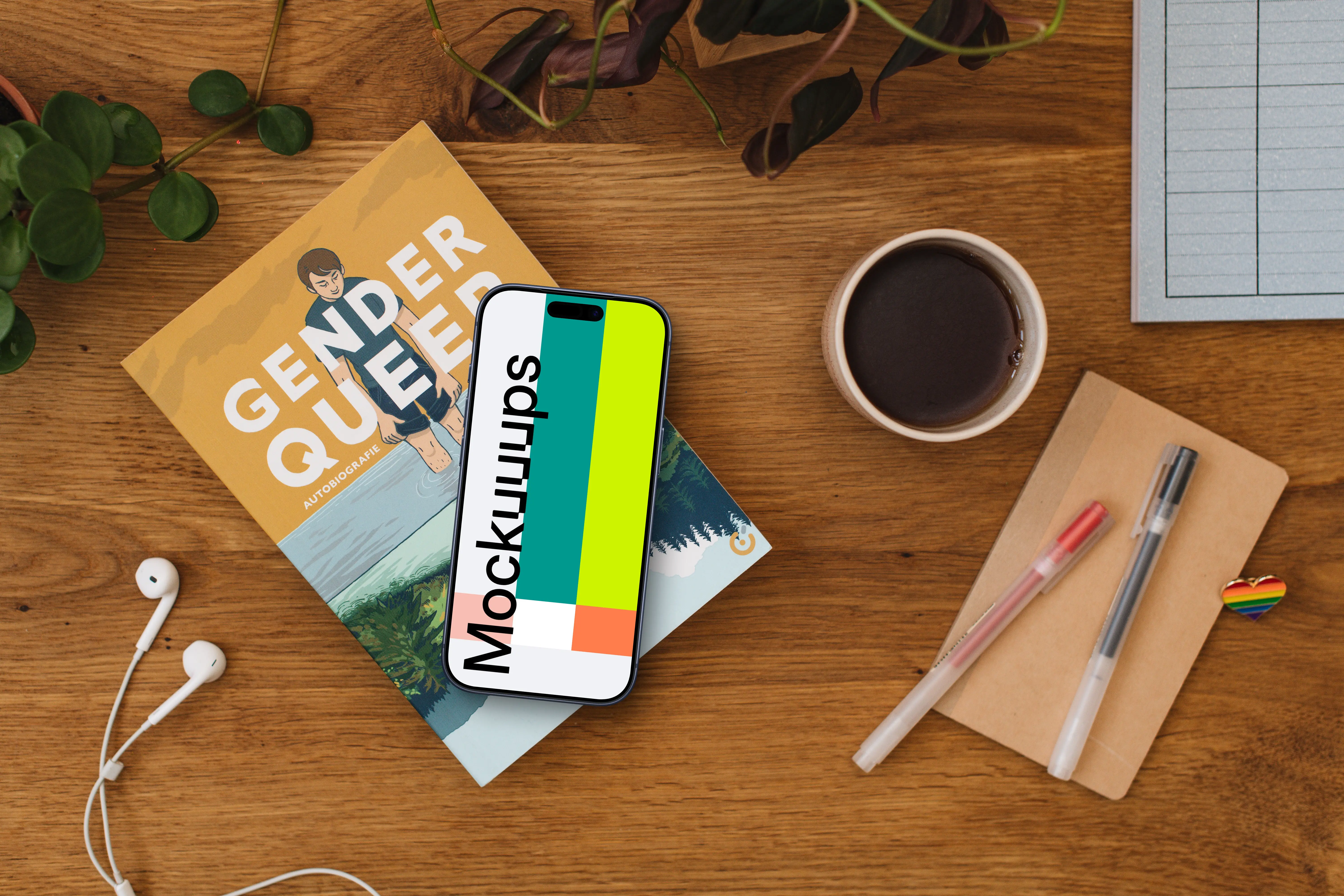 Smartphone mockup on a wooden table with rainbow heart pin