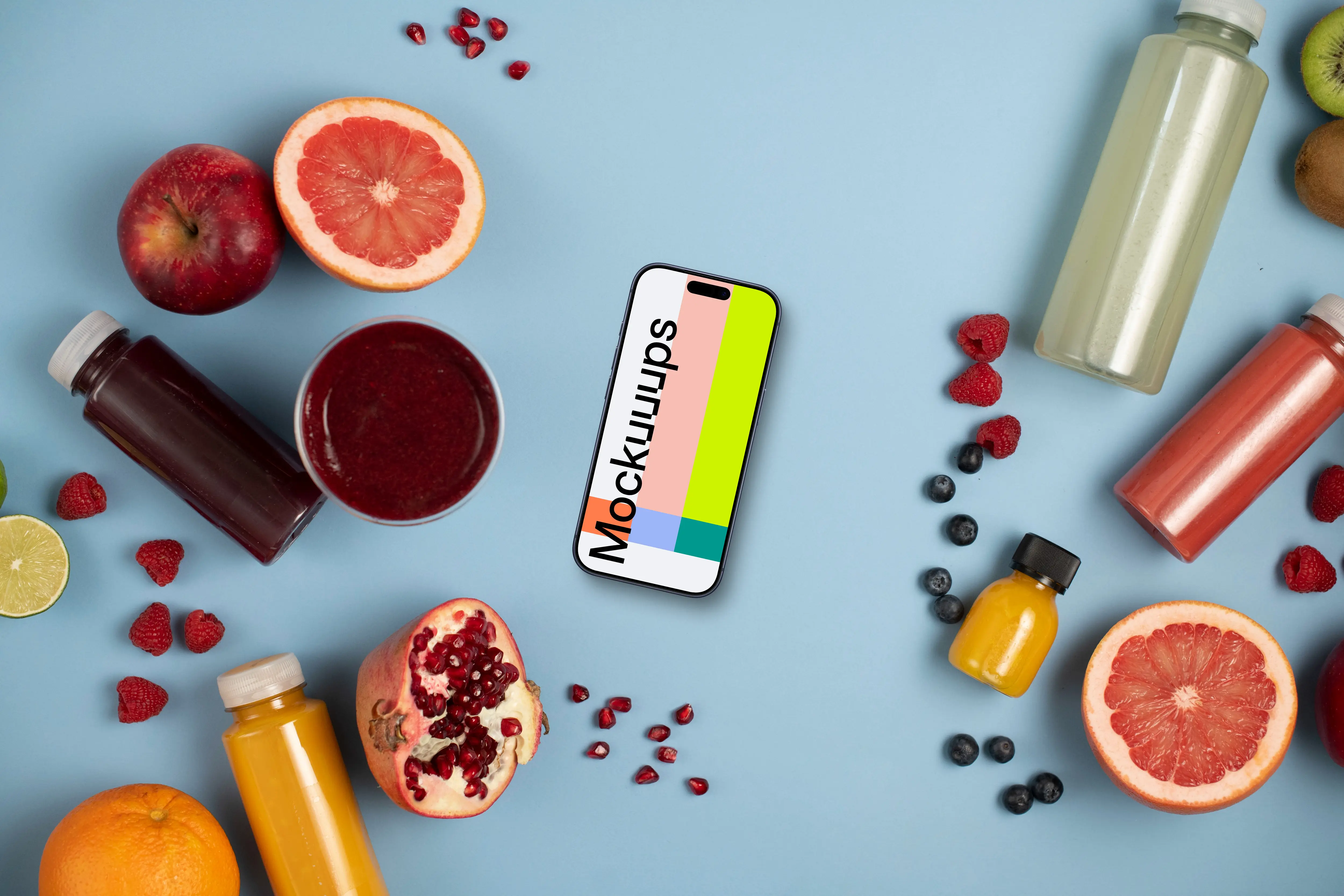 Smartphone mockup surrounded by fruits and juices
