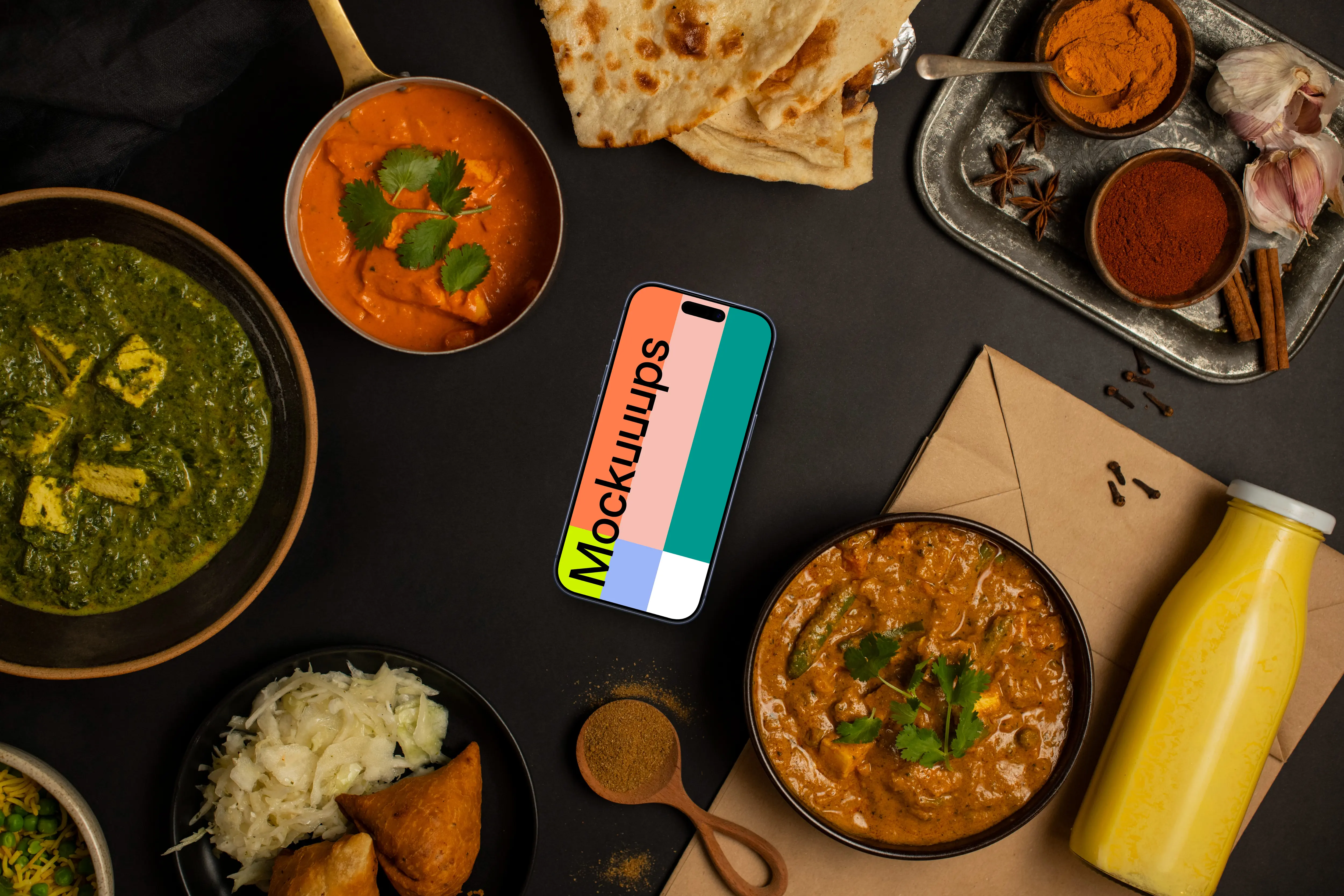 Smartphone mockup surrounded by Indian food