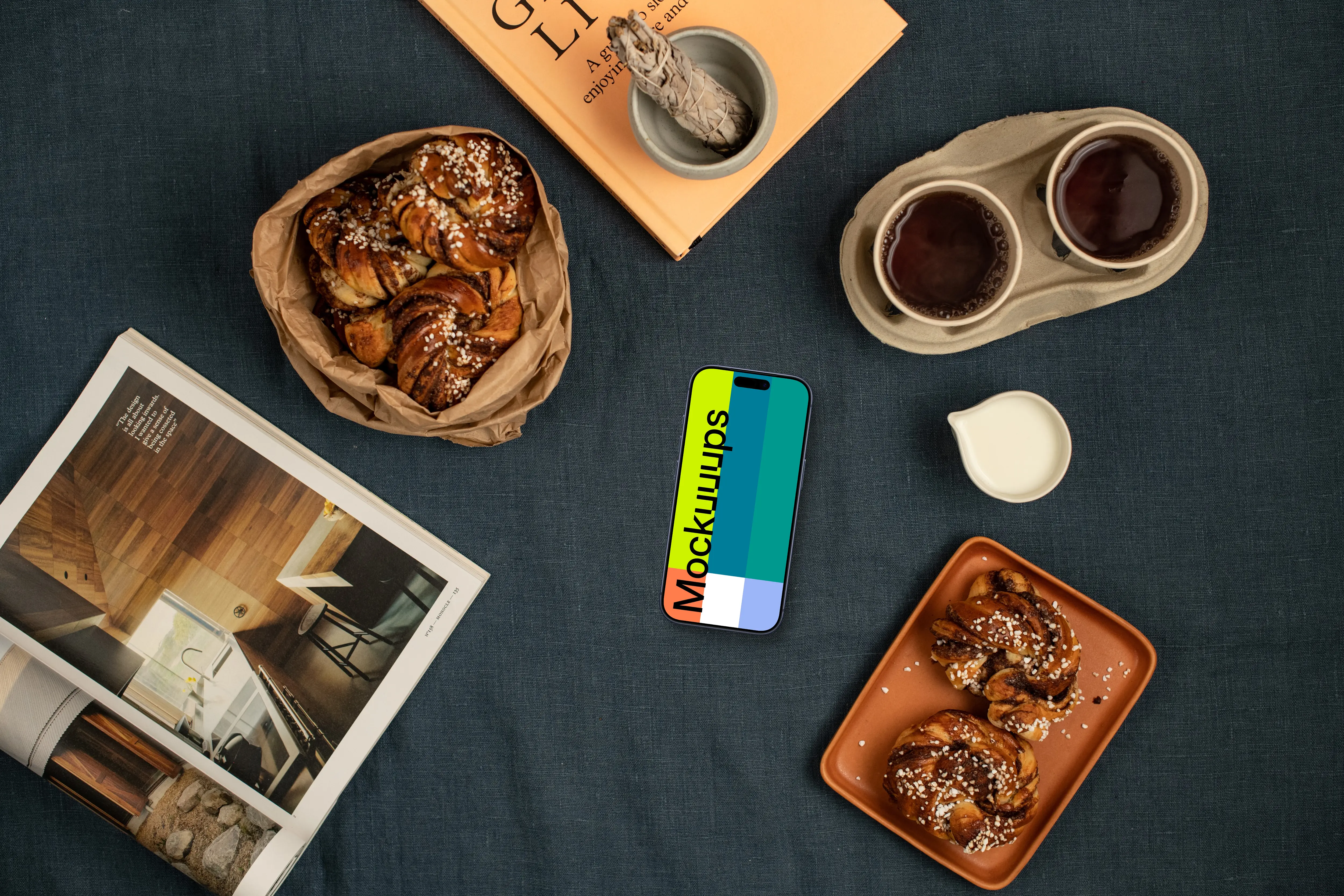 Smartphone mockup with coffee and pastries