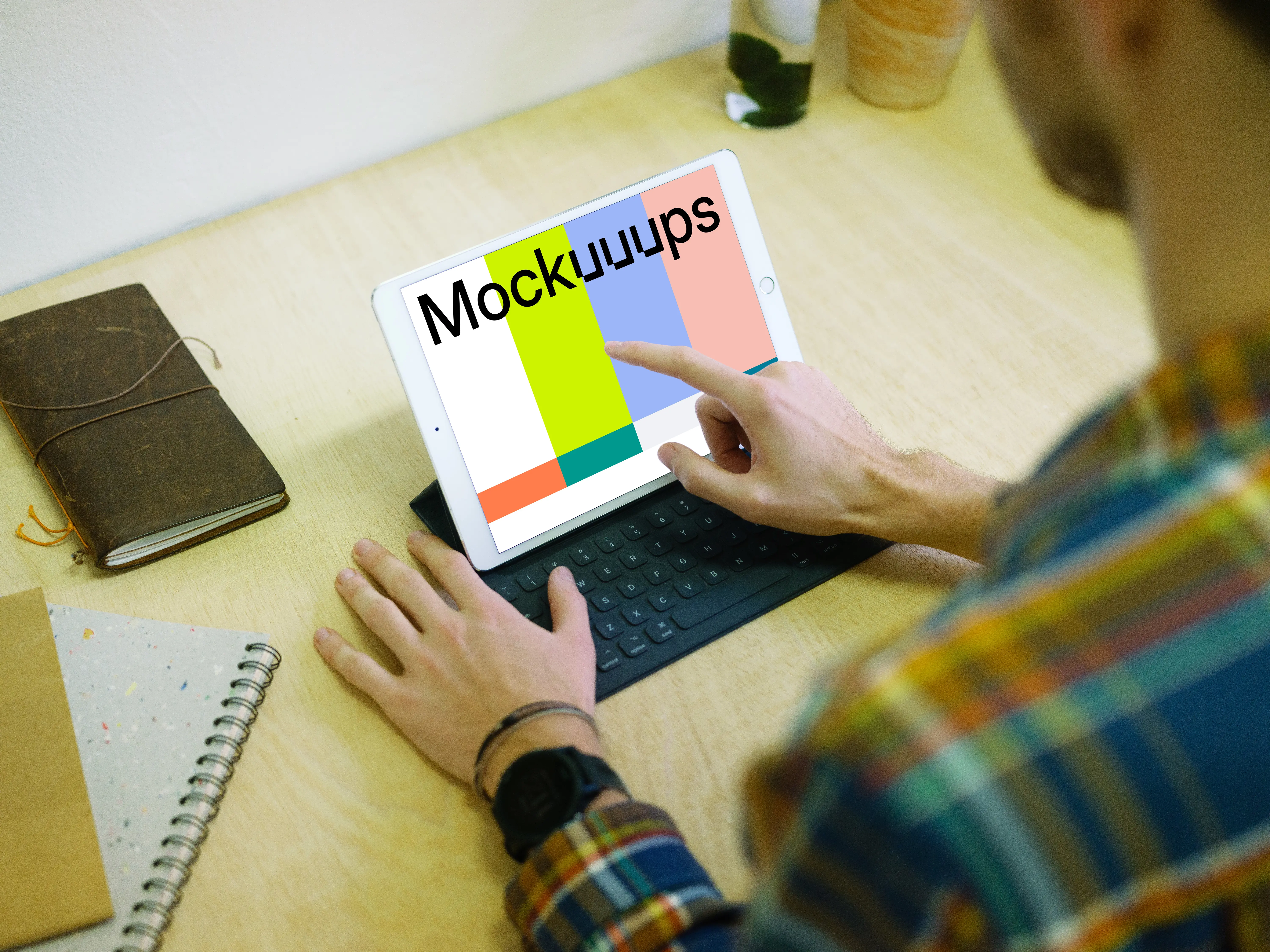 Tapping on iPad Pro mockup with keyboard