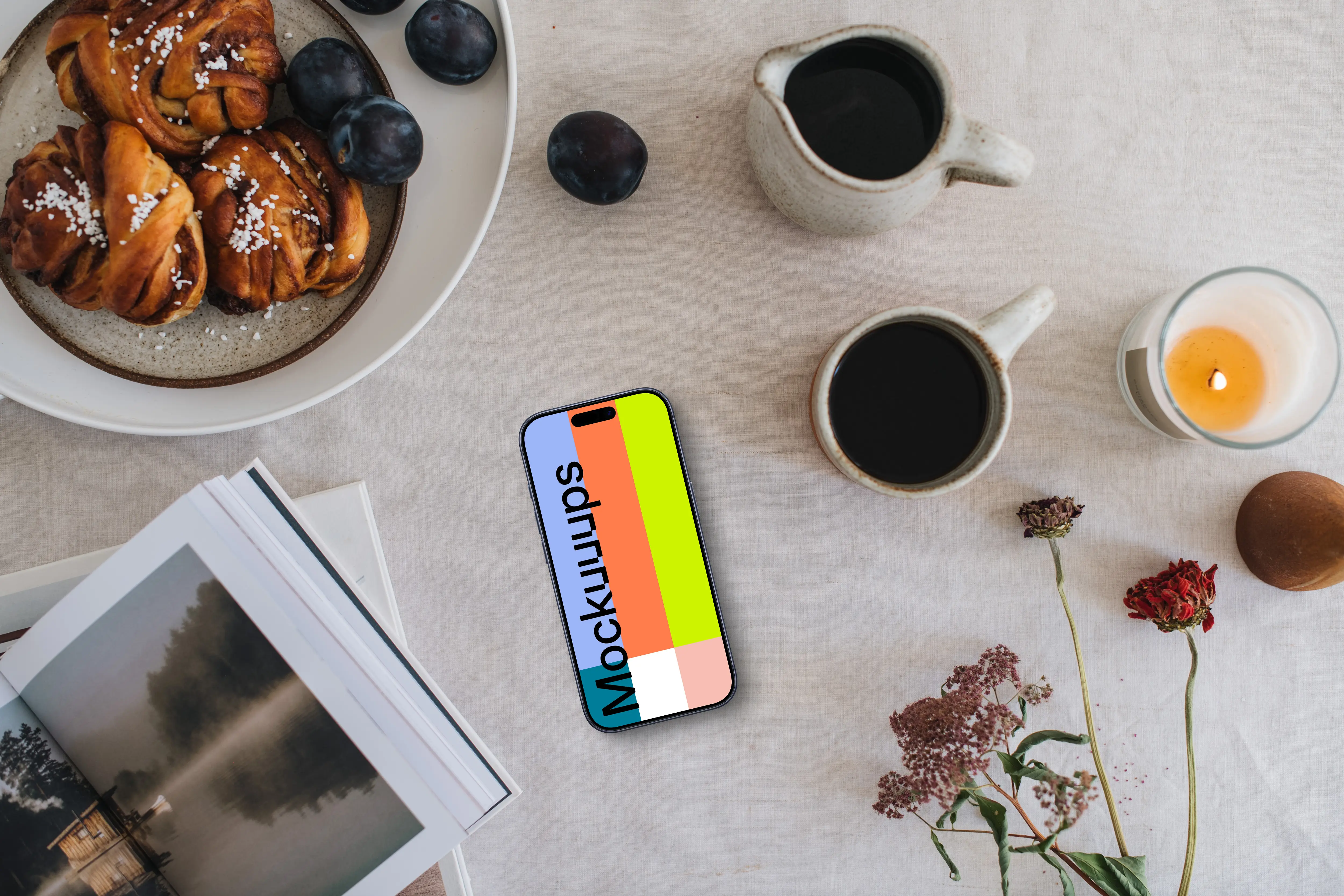 Top view of phone mockup next to the coffee