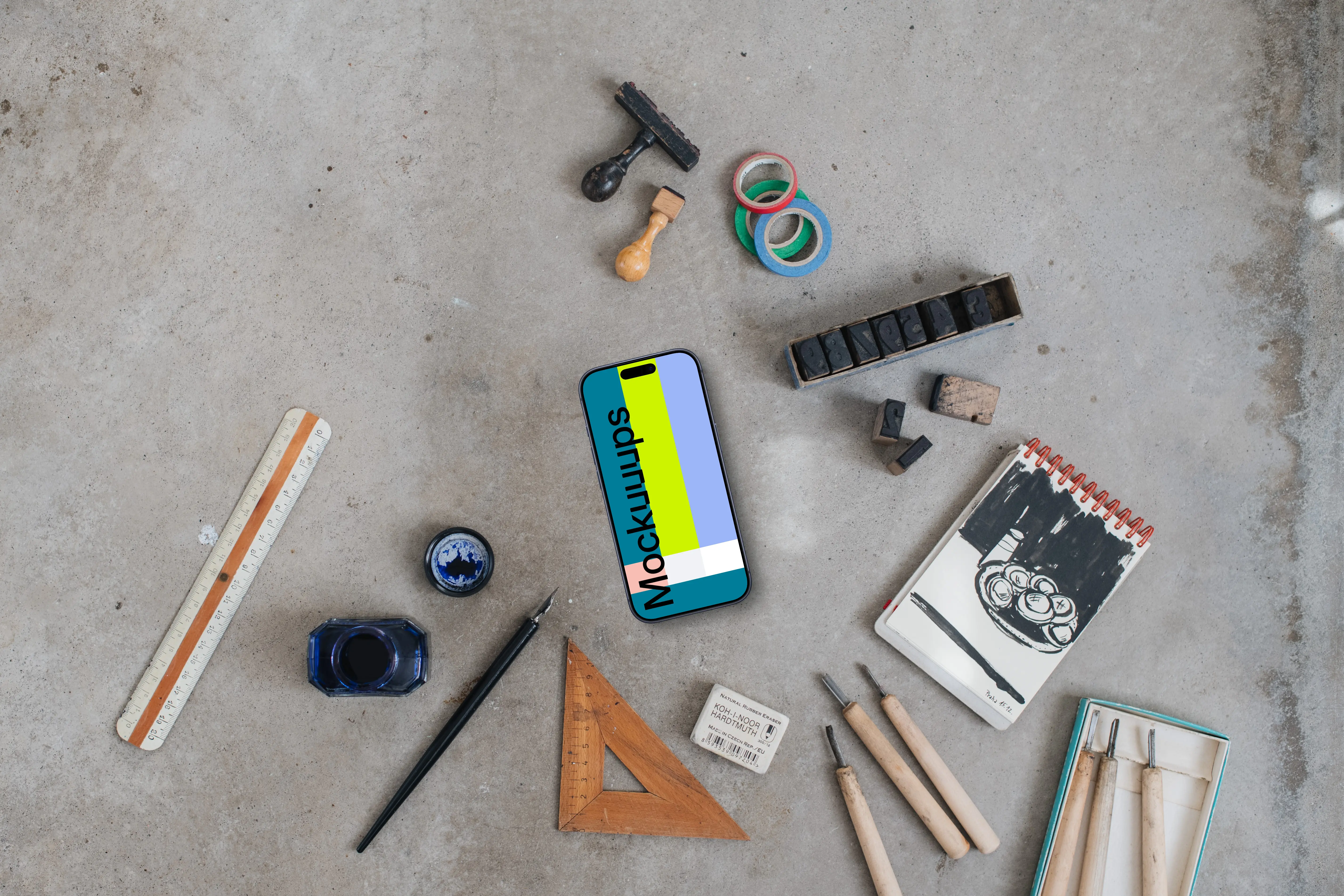 Top view of phone mockup with paintings