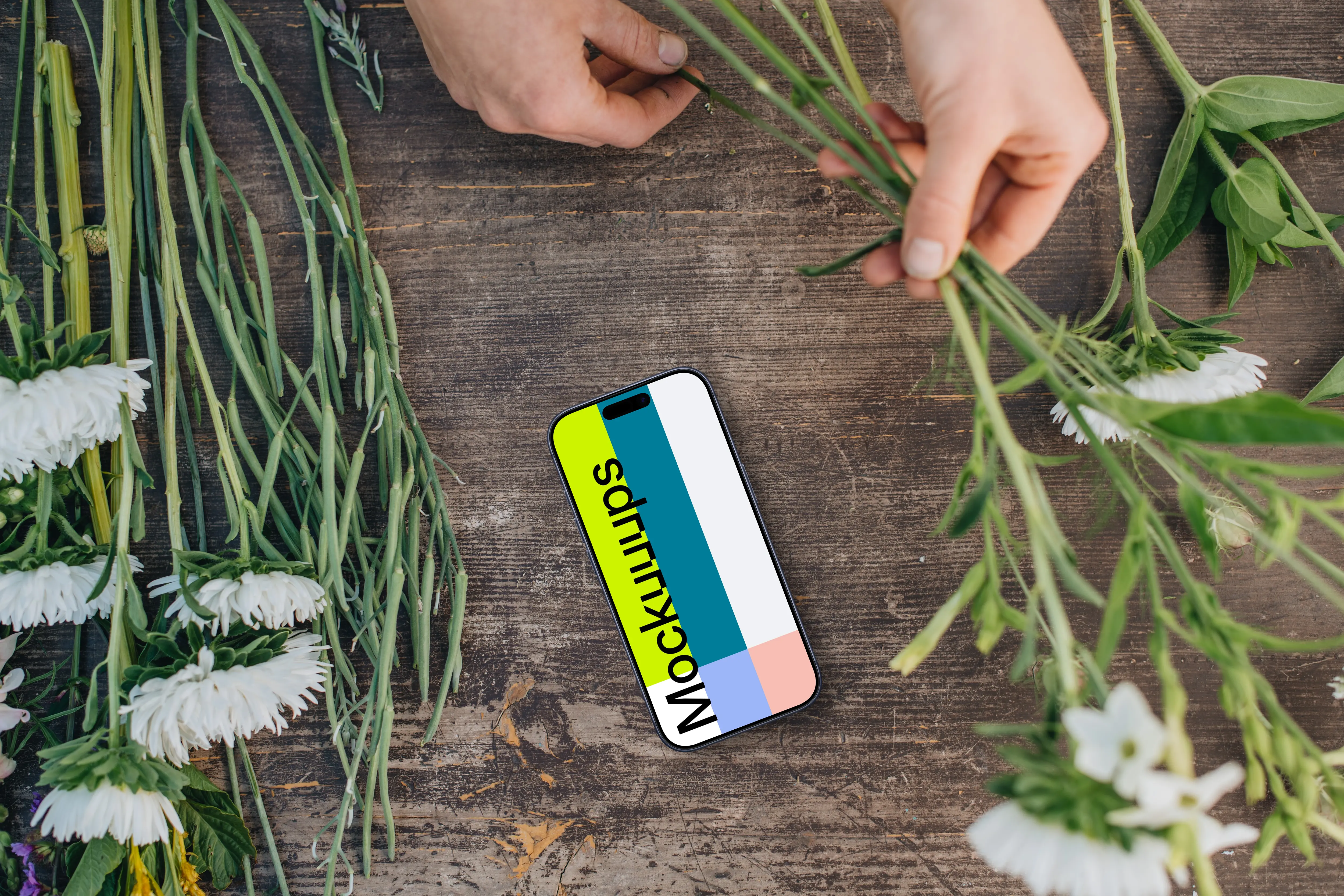 Top view of smartphone mockup with flowers