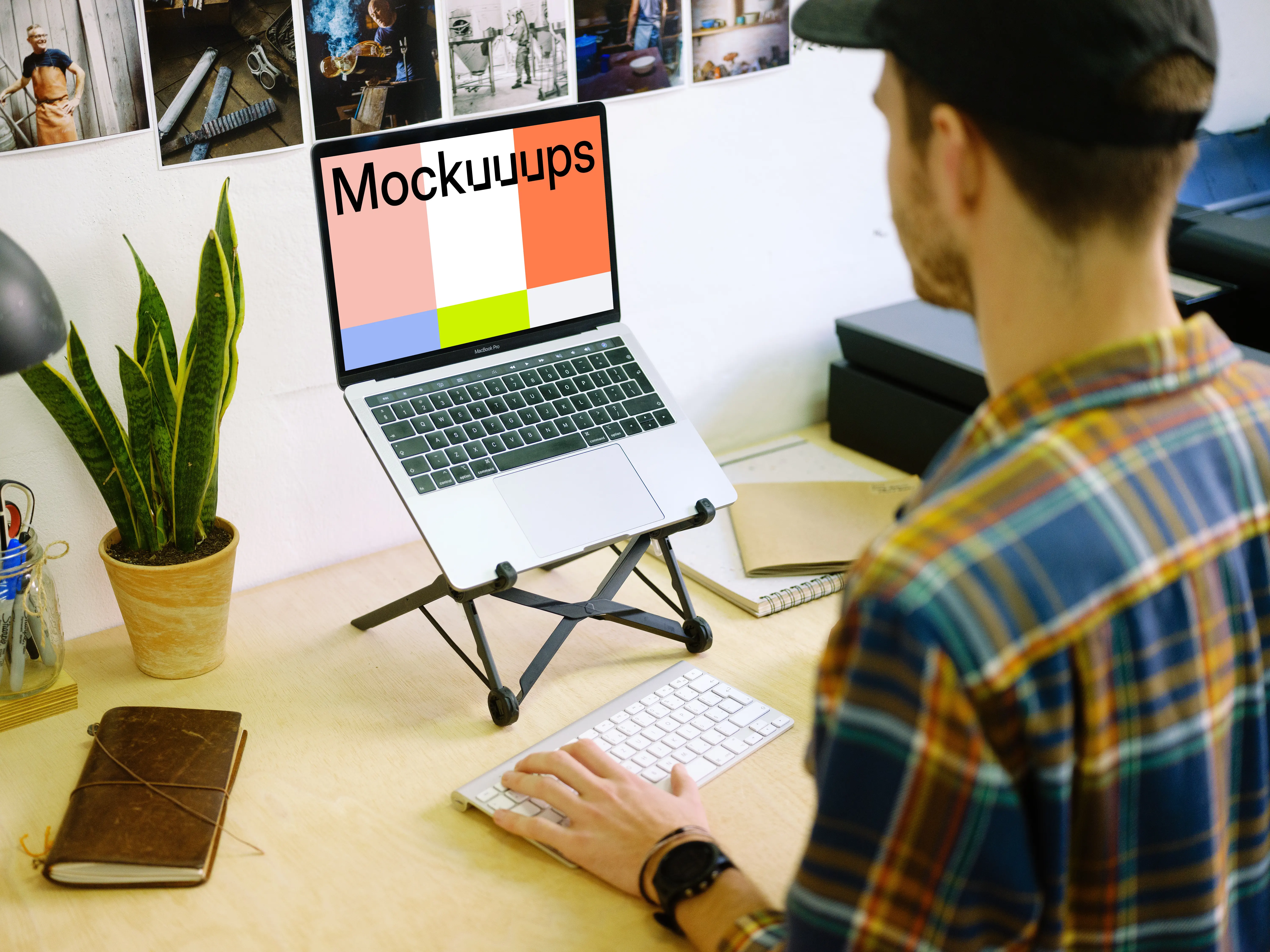 Typing on Macbook Pro mockup with desk stand