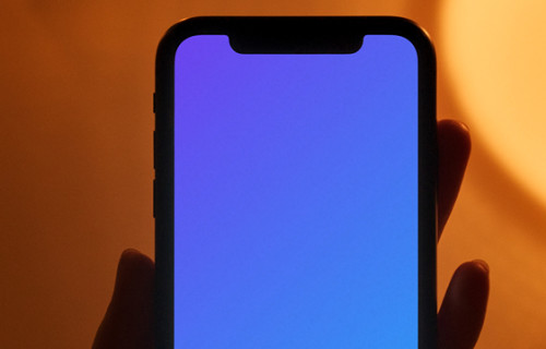 Night iPhone mockup being held by user