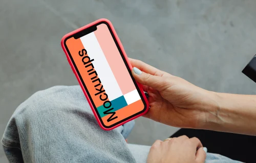 iPhone mockup held in a users hand 