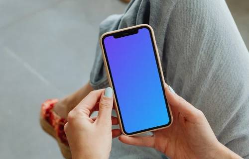 iPhone mockup in a user’s hands 