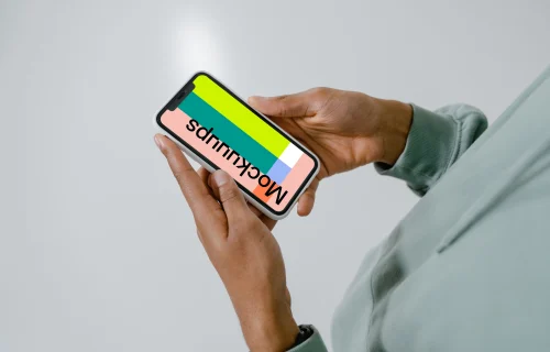iPhone mockup in user’s hand