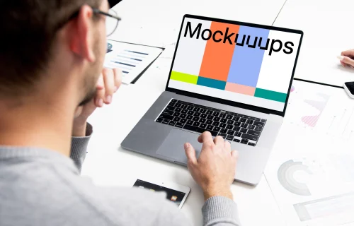 MacBook Pro mockup in a meeting