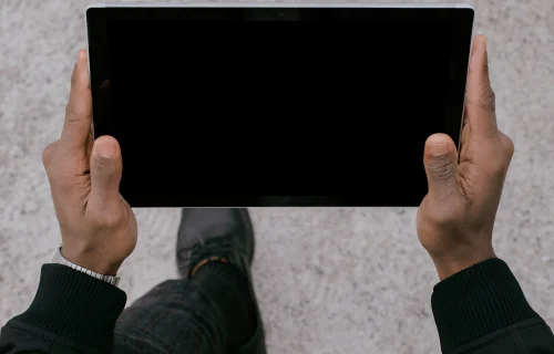 Microsoft Surface Laptop mockup held by a man