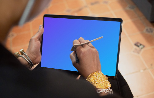 Microsoft Surface laptop mockup placed in a user’s lap