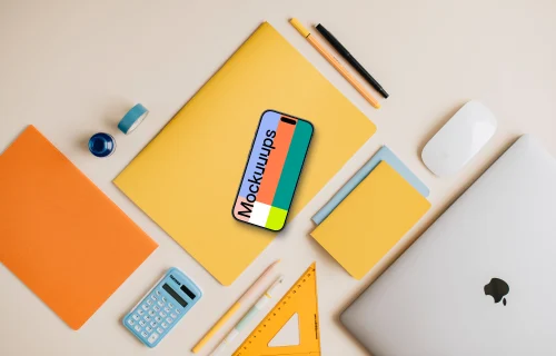 Mockup of smartphone placed on the yellow notebook