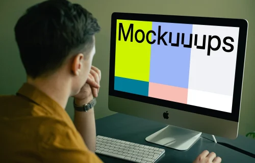 Mockup of user staring at his iMac when working