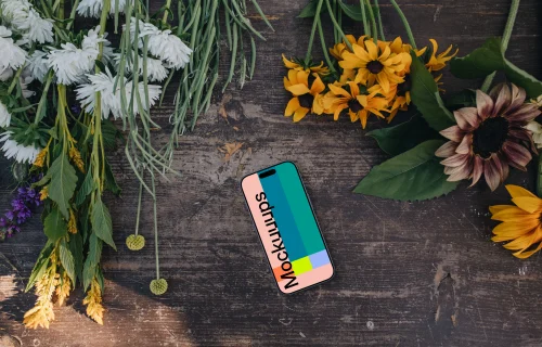 Phone mockup next to flowers