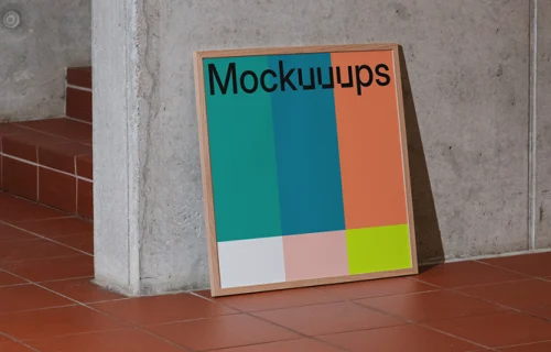 Poster mockup against a concrete wall with tiled floor