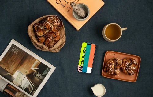 Smartphone mockup nearby pastries