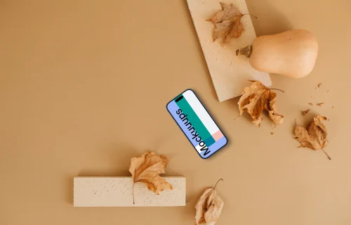 Smartphone mockup surrounded by leaves