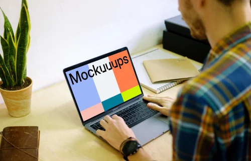 Typing on Macbook Pro mockup on desk