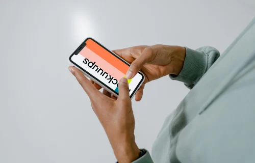 User typing on his iPhone mockup