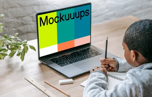 Young boy using laptop mockup